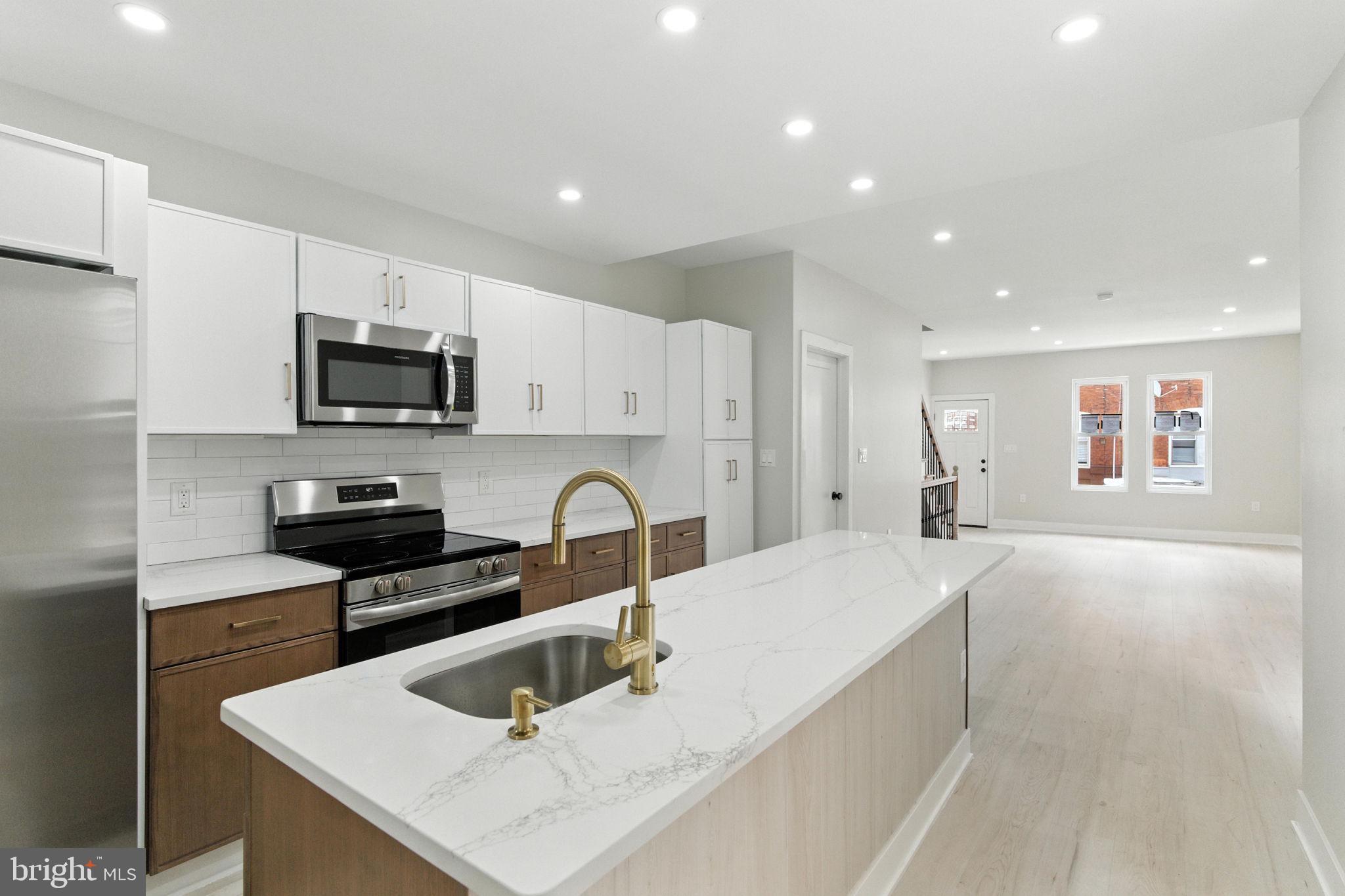 Stunning 3 bedroom, 2 full and one and a half bathroom townhome now available. Upon arrival, you'll notice a well kept block, sleek facade and ample street parking on the exterior. From there, a free flowing open concept boasting all natural light, half bathroom, modern kitchen, dining and living room combination on the main level. Next, 3 bedrooms, 2 full bathrooms and tons of closet space upstairs. And finally a finished basement and spacious fenced in rear patio perfect for entertaining friends and family! Could it get any better though? It does! This home also has a new roof, hot water heater, electric, plumbing, windows, flooring and appliances throughout. In addition, it's near all the public transportation you need to make the commute a breeze so make your appointment today before it's too late!