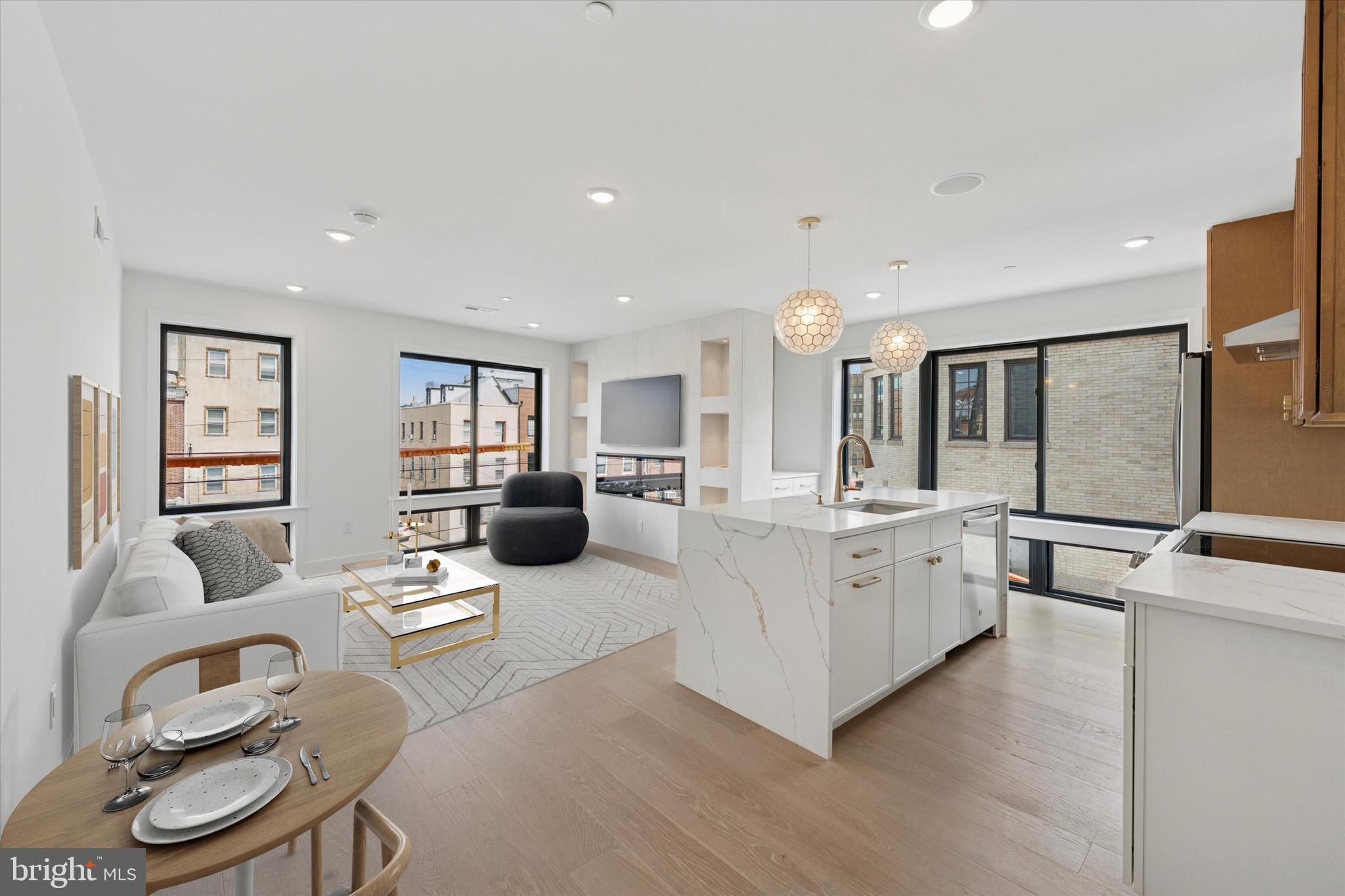 Welcome to this stunning brand-new construction corner property in the desirable Bellavista neighborhood of Philadelphia. Beautifully designed and offering modern luxury and spacious living. This top unit is three-bedrooms and three-bathrooms. Upon entering the living room the abundance of natural light throughout the home is undeniable. Bright and airy atmosphere, perfect for everyday living. The spacious layout is ideal for entertaining, with high-end finishes and plenty of room to relax. A beautifully designed wet bar leads the way as you go to the large roof deck offering breathtaking skyline views—another ideal space for outdoor entertaining or unwinding. The master bathroom in this unit is equally expansive and luxurious. Custom closets in each bedroom, top-tier finishes, combining style and functionality...this home truly has it all. The condo fee includes water and insurance