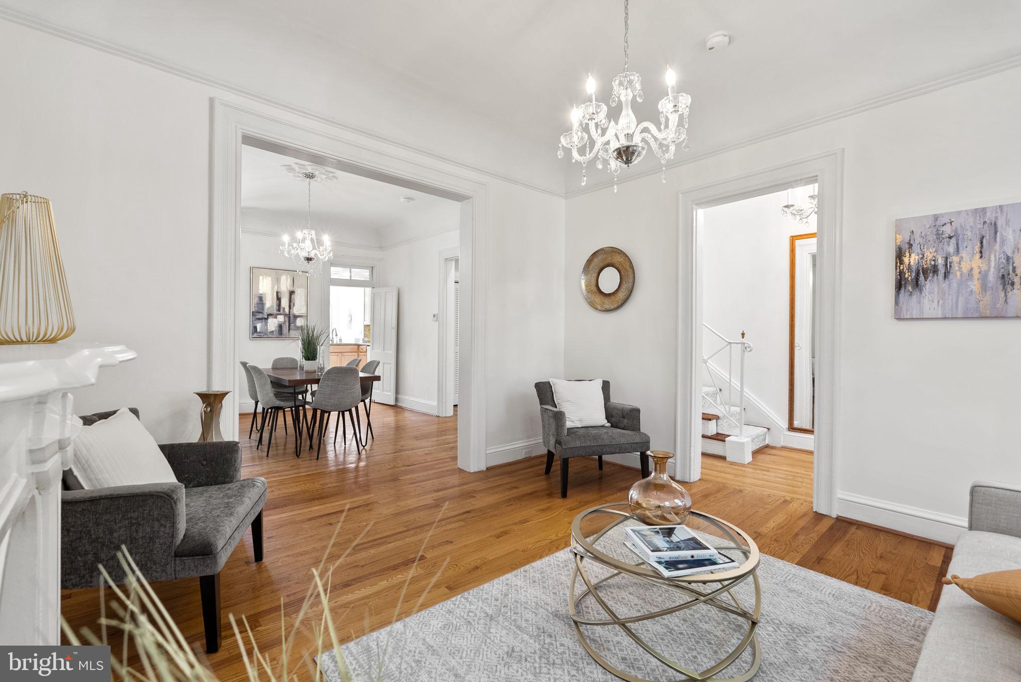 Step into a world of timeless elegance in this enchanting 3-bedroom + den, 2.5 bath classic Victorian townhome, where modern comfort meets historic charm in the heart of Capitol Hill. Soaring ceilings adorned with artisan moldings whisper stories of a bygone era. Just a stone's throw from the historic Eastern Market metro, 1 block from coveted Brent Elementary, and the very site where George Washington stayed, this home embodies the essence of Capitol Hill.
Built in 1880 and meticulously maintained, the stunning stone-clad facade and elevated front porch immediately captures your attention. Inside, soothing hues, crystal chandeliers, and hardwood floors flow throughout, creating a harmonious blend of Victorian nuance and contemporary convenience. Double doors from the vestibule open into an entry hall illuminated by skylights and large windows (with green garden views), spilling natural light across the elegant staircase.
Palladian glass built-ins display cherished keepsakes in the dining area, while the exquisite original Victorian gas-fired fireplace, framed by a beautifully crafted mantelpiece, serves as a striking focal point, inviting warmth and nostalgia into the heart of your home.
Your modernized kitchen displays sleek counter tops, ample cabinetry, and a host of appliances support any avid cook—perfect for relaxing or entertaining. Savor breakfast in the sunny nook, complete light work at the kitchen office desk, or enjoy the bright top-floor office/den - if not used as a nursery. Then retreat to your private oasis—a secluded deck that overlooks a lush, two-level garden, ideal for morning coffee or evening gatherings. Impress your guests with a charming stroll through the historic secured tunnel from the back deck to the front walkway, or allow caterers/contractors easy access to the back for your garden or home party.
Upstairs, the primary bedroom features a generous original walk-in closet and shares a renovated bathroom with the second bedroom. The roof is perfect for future solar panel installation or transforming it into a stunning roof deck ideal for hosting memorable firework-watching parties. The above-ground guest quarters on the first level provide flexibility for multi-generational living or an au pair, featuring a full bath, kitchen, and private garden patio.
Be part of a vibrant community with friendly neighbors—where local events and gatherings foster a true sense of belonging.
With a walk score of 98 (a walker’s paradise), you are steps away from two nearby Metro stations, Eastern Market, Barracks Row, and the shops and restaurants on Pennsylvania Avenue. Enjoy local concerts, world-famous acts, national festivals, and the indoor/outdoor Botanic Gardens (with living deserts, ancient forests, and towering jungles year-round). Stroll to the free aquatic center, hit the nearby gyms for a workout, or indulge in a pampering session in one of the local spas.
Blocks away from smaller and larger parks—Folger, Providence, Marion, Garfield—and with 300 acres of the National Mall, you have endless access to free museums, nature, concerts, cultural festivals, and annual cherry blossom and fireworks events. With miles of coastal and scenic bike and walking trails, you can easily access the riverfront, local parks, islands, and vibrant sports arenas—there’s truly something for everyone.
Seize this rare opportunity to own a piece of history—schedule your private tour today and immerse yourself in the enchanting magic of this home before it’s gone!