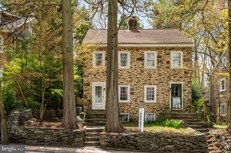 Oh, the charm of 73 W. Rose Valley Road! This historic 3-bedroom Stone Mill house was transformed by William Price. Price founded Rose Valley in 1901, and built/redesigned these residences for the Mill workers after the Civil War.  According to an unidentified article, probably written c.1904, they "have been turned into quaint and picturesque little homes" for the artisans and their families. The houses consisted of three twin houses on the south side of Rose Valley Road and a row block which had six units in a continuous row.
   Built with 18-inch stone walls, the features of 73 W Rose Valley Road include original interior mill work and hardware, deep window casings, some original windows (note the swirls in the hand-blown glass), unusually high ceilings, exposed beams, wood oak and Pumpkin Pine floors throughout, a small fireplace in the Living/Dining Room, a Kitchen with door to a lovely courtyard with terraced stone gardens and steps up to each level. There is a built-in shed for garden tools and a built-in whole home system automatic generator by Honeywell.  The Second Floor has 2 bedrooms and a full bath with an antique claw foot tub. The Third Floor is an entire bedroom with 1/2 bathroom and extra closet space. The Basement is functional. Knob & tube remediation in 2023. Updated/or new utilities.
The Borough of Rose Valley owns and maintains the parking lot across the street for you and your guests. For nature lovers, Maurice Saul Wildlife Sanctuary next to the “Old Mill” is a quarter of a mile away. The Borough of Rose Valley provides a large network of maintained walking trails through a forest path that wind around the Borough.  In addition is Chadwick Wildlife Preserve. Also nearby is The School of Rose Valley, Hedgerow Theater (the oldest repertory theater in the country) offering presentations and classes, the Rose Valley Museum, the private Rose Valley Pool and Tennis club, Media’s renowned restaurants and shops, along with the Moylan-Rose Valley train station. The Wallingford train station, up Possum Hollow Road, is about a mile away. Here you will find a small post office, public library, restaurant, convenience store and Furness Park. 
This historic Artisan’s Mill house offers a unique green and wooded preserved community of yesteryear with the necessities of today. The Philadelphia National airport is an easy twenty minute drive!  Feel right at home here with local events, neighborhood watch, the Rose Valley Garden Club and the local Mayor available throughout the year.