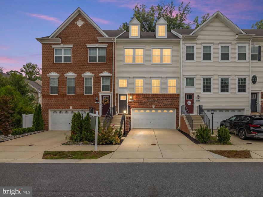 VA ASSUMABLE available for 2.5% Absolutely one of the best homes on the market in Summerfield Village. VA 5.5% Rate offered NO points 30-year fix.  You must see the stunning 2019 townhome features the pride of home ownership.  NEWER HVAC and Hot Water heater purchased in 2023. As you walk in the foyer to the platform enter into this meticulous home. Large living room with custom plantation shutters throughout the entire home.  Dining area adds to this perfectly designed level along with 10 ft ceilings and luxury vinyl flooring. Gorgeous Kitchen with CABINETS GALORE, granite countertops, herringbone tile backsplash, deep sink, custom lighting, stainless-steel appliances and window with views of the back deck and trees, full custom built-in pantry, serving buffet/wine rack and breakfast bar. NEW TASTEFUL FIXTURES throughout.  Large open floor concept. The kitchen leads to maintenance free large deck with privacy wall. Perfect for entertaining! Private tree view! Primary bedroom features a large custom built-in walk-in closet with a window. Secondary Bedrooms perfect size for guest room, child room or office.
Above ground basement with stellar family room for movie night! Features hardwood steps, half bath. Walk out the double sliders to a PRIVACY FENCED yard with patio and turf which makes this home almost maintenance free. Enter through the two-car garage into the mudroom.  HOA includes Trash- Snow removal and Salt streets only- Common Area Lawn Maintenance, Dog park- two tots lots and picnic area. Close to Fort Meade, Marc train, Baltimore, Historic Annapolis and Washington DC. Central Maryland at its finest, Waugh Chapel shopping center is less than 5 minutes away. Enjoy Gambrills at its finest!