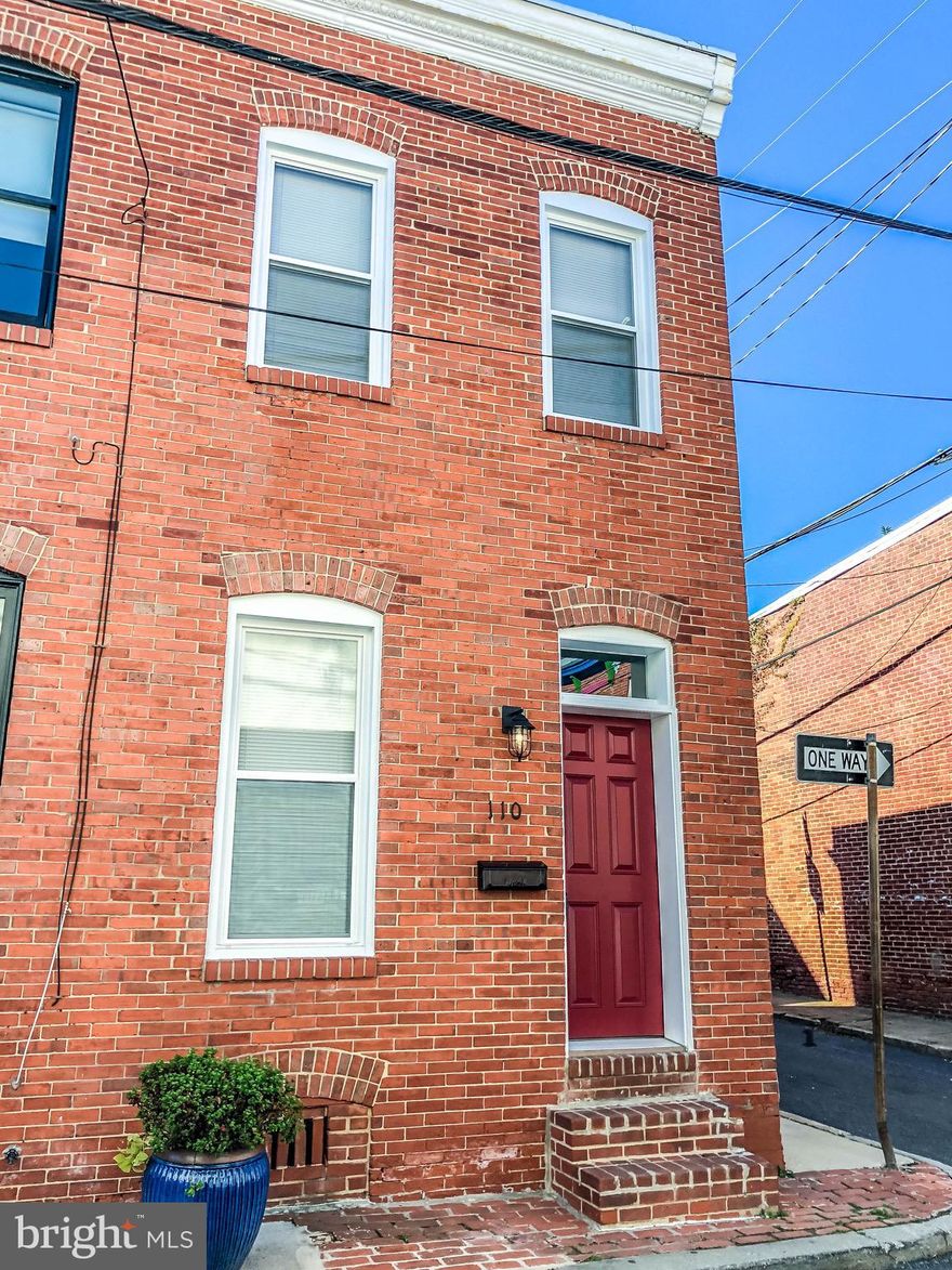Don't miss this BEAUTIFULLY RENOVATED two-bedroom, one bathroom, END-UNIT rowhouse, in the popular Butcher's Hill neighborhood! Flooded with natural daylight, this home boasts tons of amenities with upgrades throughout, such as new LVT flooring, all brand-new thermal windows, LED recessed lighting and surface mounts, new QUARTZ countertops, freshly painted walls and woodwork, new berber carpeting on stairs and 2nd floor, completely WATER-PROOFED basement, brand new refrigerator, microwave and more! This home is a buyer's dream come true! As you walk thru the front door you enter into the cozy living room-dining room combo, you are then greeted into a BEAUTIFUL kitchen. Washer/dryer is on the main level making it very convenient to do laundry. Out back, you have an enclosed patio which could easily be converted into a private PARKING PAD! Curb is already cut making it convenient to park and sellers are willing to remove fence with an acceptable offer. As you walk upstairs along the beautiful exposed brick wall, you are greeted with two great sized bedrooms and a full bath, newly renovated, in the hallway separating the bedrooms. This home is close proximity to Johns Hopkins main campus and Patterson Park. Schedule your showing today! ***QUALIFIED FOR LIVE NEAR YOUR WORK PROGRAM***