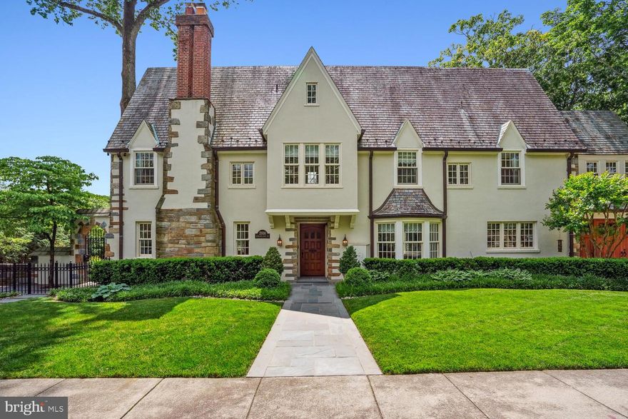 Fantastic Massachusetts Avenue Heights Tudor with over 6,000  square feet (est.) across 4 levels on a prominent .22 acre lot. This beautifully renovated home has a traditional sun-drenched floor plan with gleaming hardwood floors, soaring ceilings, custom built-ins and exquisite craftsmanship and millwork throughout. The first floor has a gracious entry foyer, living room with fireplace and access to the terrace, family room with built-ins, formal dining room, gourmet eat-in kitchen with stainless steel appliances, and a powder room. The second floor has a deluxe primary suite with two walk-in closets and two baths, office, two additional bedroom suites, and a laundry room. The third floor has two bedrooms, one full bath and a storage room. The lower level has an exercise room, recreation room with kitchen, additional family room, bedroom, full bath and additional storage and laundry room. Lastly, this home has an attached garage, sport court and trampoline, side and rear terraces and professionally landscaped gardens.