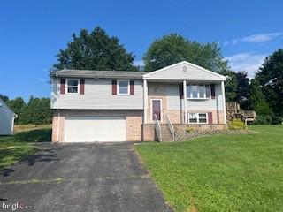 Wonderful opportunity to purchase this large split level home on an oversized lot and make improvements to your taste! Home features 3 generous bedrooms and 1 full bath, a traditional living room, dining room, kitchen layout on the upper floor. PLUS an addition used as a sunroom. Lower level comprises as a large family room with brick fireplace and a laundry room/bathroom combo. The two car front loading garage accesses the lower level of the home. Make your appointment today to see this property. Priced like a starter home but made to be a forever home.