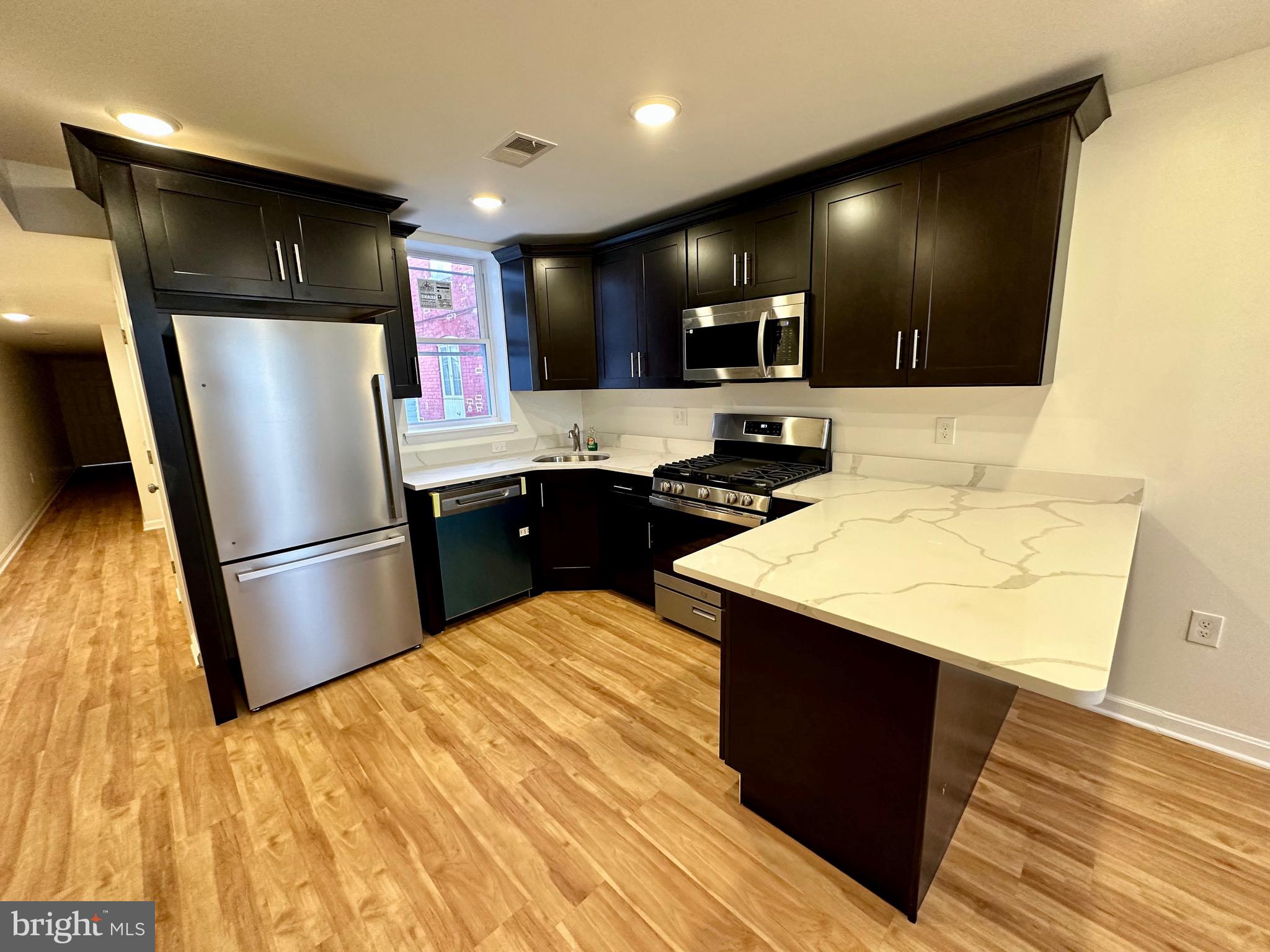 Available for immediate move in! Newly renovated 2 bedroom, 1 full bath ground level apartment, offering modern living in a prime location. Step into this recently constructed unit and be greeted by the pristine interior featuring new stainless steel appliances, perfect for whipping up delicious meals. The convenience of an in-unit washer/dryer adds to the ease of daily living.
This apartment boasts luxury vinyl plank flooring (LVP) throughout, providing durability and style, while recessed lighting and ceiling fans offer comfort and ambiance. Pets are considered on a case-by-case basis. The back patio is shared with unit above. Outdoor furniture has been provided for use by the owner. 650+ credit score is required. Tenant responsible for BGE/Electric/Water.
Conveniently located within walking distance to dozens of restaurants, as well as the iconic Little Italy and Inner Harbor, residents will delight in easy access to the city's best dining, shopping, and entertainment options. Additionally, Harbor East, known for its upscale shops, restaurants, and waterfront views, is just a short stroll away, adding to the vibrant urban experience.
For healthcare professionals, Johns Hopkins Hospital is just a twenty-minute walk away or a quick 5-minute bike ride, ensuring a stress-free commute. With Whole Foods also within walking distance, fresh groceries and gourmet treats are always within reach. Additionally, the Johns Hopkins Carey School of Business is a mere 10-minute walk away, making this apartment an ideal choice for students and faculty alike.
Don't miss out on the opportunity to call this brand new apartment home, where convenience, comfort, and modern living converge in one desirable location.