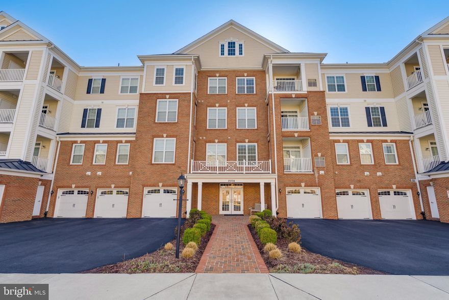 ​Welcome to this bright and inviting 2-bedroom, 2-bathroom end-unit condo,
nestled within a secure building in the vibrant 55+ community of Regency of
Ashburn Greenbrier. The open floor plan is bathed in natural light, thanks to
numerous windows that offer serene views of the surrounding trees and open
spaces. A private balcony provides a peaceful retreat to enjoy the soothing
sounds of nature.<BR>
<BR>The foyer entry leads to a spacious living room and dining room, seamlessly
leading to a well-appointed kitchen. The stunning kitchen has a huge breakfast
bar, 42” Timberlake cabinets, gorgeous granite countertops, under cabinet lighting and stainless-steel
appliances. As you head over to the bedroom you will enter a spacious primary
suite which features a sitting area, a walk-in closet, a large second closet and an
en-suite, luxury bathroom with a large walk-in shower, double sink vanity, and a
linen closet. This space provides comfort, privacy and a place to relax. The second
bedroom is located off the foyer and offers a large closet and 2 oversized
windows for tons of natural light. The hall bath has a shower/tub combo with
tiles to the ceiling.<BR>
<BR>An oversized garage (28X17) is conveniently located and comes complete with a large
workbench, perfect for hobbies! You will love the tons of additional storage space
and still have plenty of space to park your car.<BR>
<BR>Take advantage of recreational amenities, including a clubhouse, fitness center,
game room, outdoor pool, biking/walking paths, and the extensive Ashburn
Village amenities, fostering an active and engaging lifestyle. Other conveniences
include elevator access to all floors, private and gated community, secure access
to each building, community room in the building, and so much more! The
mature tree-lined streets are warm and welcoming. This condo combines
convenience, comfort, and community, making it an ideal place to call home!
Close to  One Loudoun, restaurants, shopping, major roads and so much more!