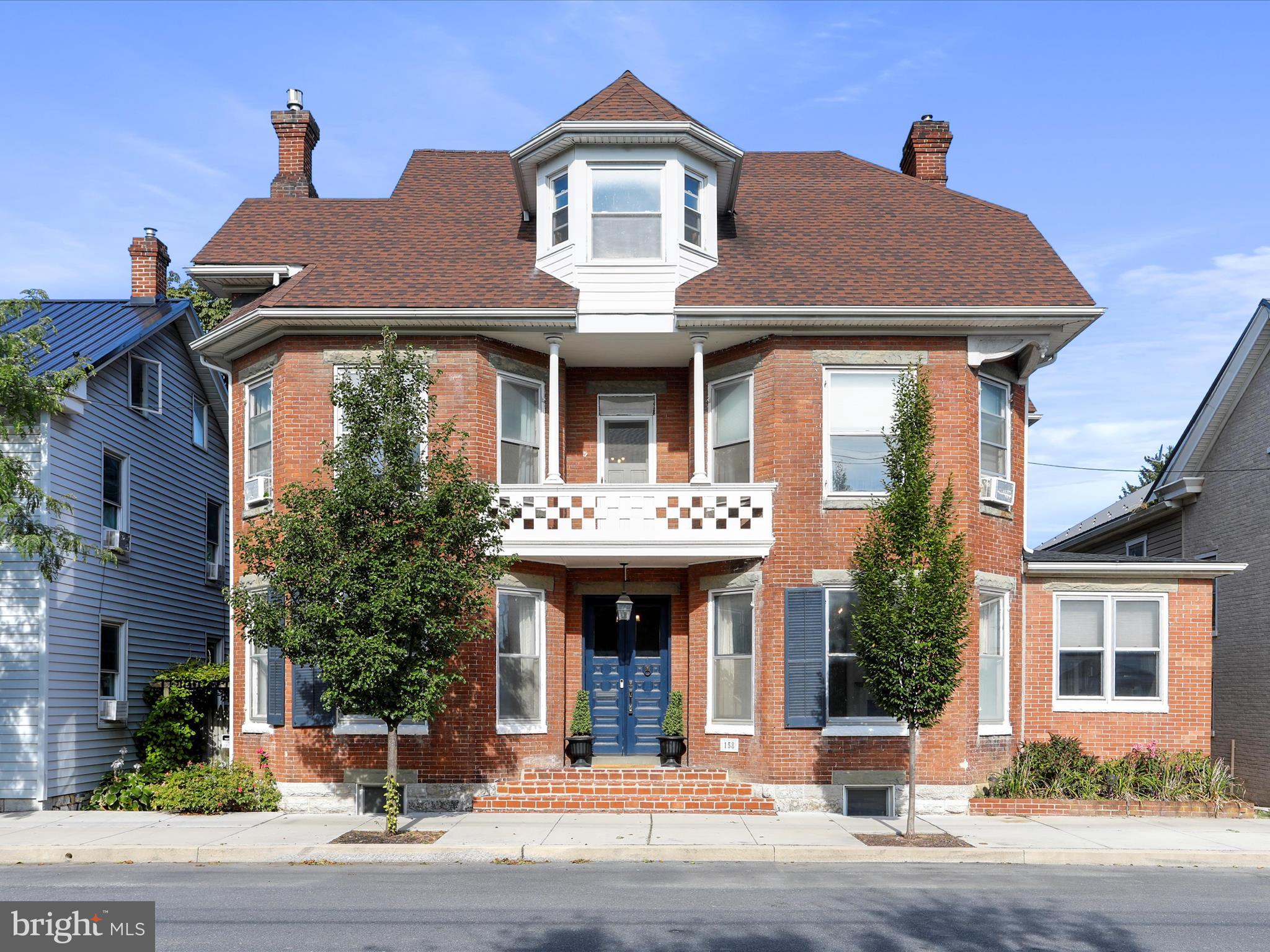Welcome to 158 N Carlisle Street, a classic historic home in the heart of downtown Greencastle! This stunning residence features 4 spacious bedrooms, 3 full baths and a beautiful modern kitchen with updated cabinets, sleek countertops, and a massive breakfast bar - perfect for gatherings. The grand entryway, complete with custom-tiled address foyer and elegant staircase, sets the tone for the home’s timeless character. Formal living and dining rooms showcase rich details, while pocket doors, deep window sills and trim add to the historic charm throughout.
Enjoy 3 versatile flex spaces including a workout room, cozy reading nook, and enclosed back porch. Step outside and be amazed by the oversized backyard, an oasis rarely found in town, featuring a detached 2-story garage, storage shed, hot tub area with pergola, and thoughtful landscaping.
Perfectly situated within walking distance to Greencastle’s vibrant downtown, you’ll love being just steps from local restaurants, coffee shops, ice cream parlors, community events and the local park! This luxurious yet welcoming home offers the best of both worlds: modern updates, historic character, and small-town charm. Don’t miss your chance to call it yours!