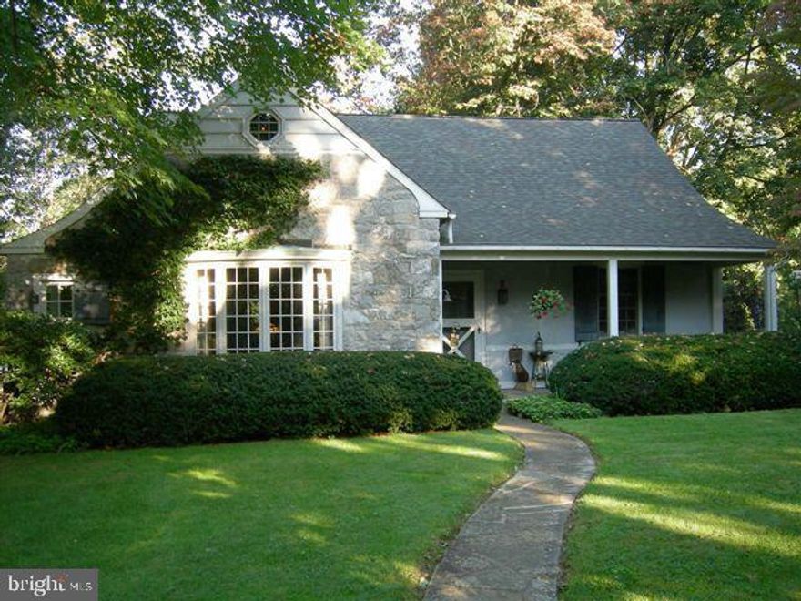 Charming 1938 Stone Home in Country Club Estate Tucked into a wooded lot in the sought-after Country Club Estates in Manheim Twp, this 4-bedroom residence offers the rare ease of one-floor living paired with timeless character. Rich finishes, softwood floors, a sun-splashed bay window, and a striking stone fireplace reflect a classic approach to design that feels both warm and welcoming. With central air already in place, the home balances vintage charm with everyday comfort. Outside, beautiful grounds invite you to relax on the private patio, enjoy the soothing fish pond, or make use of the detached garage/shed. While a few spaces are ready for your personal touch, this home’s craftsmanship, setting, and storybook appeal create an inviting canvas to make your own. A rare opportunity to live in one of the area’s most desirable neighborhoods.