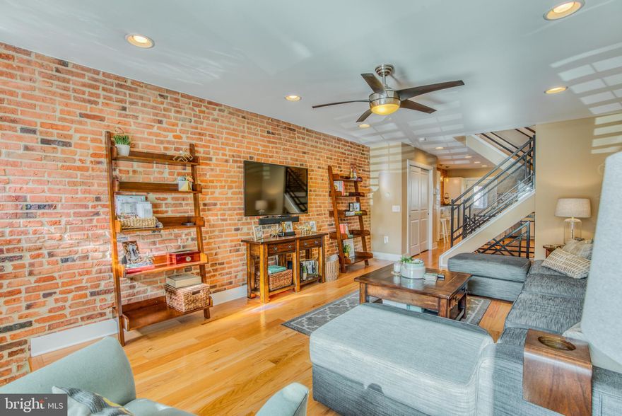 Whether you are looking for a roommate situation or looking to move your family, you've got to see this incredible space. Located in the popular neighborhood of Brewers Hill/Canton, this 3 bedroom, 3 full bath, row home offers 3 finished levels of living. Light maple hardwood floors throughout the home give this property a bright and airy feel. The kitchen is wide open with a large breakfast bar, stainless steel appliances, granite counters, and plenty of table space. There is a roof deck that offers a panoramic view of the area. 3710 Fait Ave is on a wide street, convenient to 895, 95, 83, and John Hopkins.