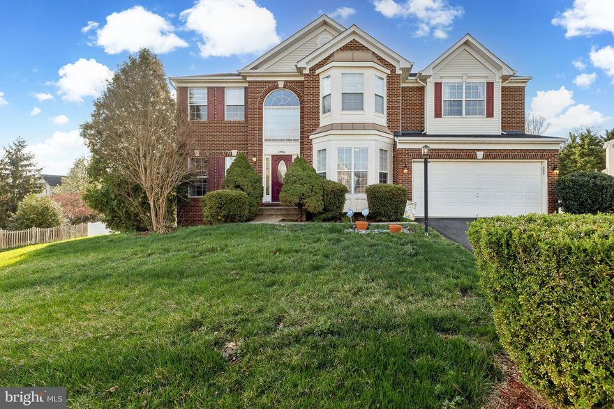 Welcome to this inviting home in the Villages at Bristol community!  Situated on a peaceful cul-de-sac and boasting natural lighting throughout the home.  This beautiful 2800+ sq ft home offers a main level bedroom and full bathroom.  Enjoy easy interaction between family members or guests in the open concept kitchen and family room space featuring elongated windows as well as a beautiful gas-burning fireplace. The kitchen sliding door opens up to a large deck, perfect for entertaining while overlooking the tranquil backyard and lush peach tree.  Upstairs, you’ll find the spacious primary bedroom, which includes a large walk-in closet and en-suite bathroom with dual sink vanity, soaking tub, and separate shower. The three secondary bedrooms share a full bathroom. The basement is perfect for entertaining or unwinding, complete with a half bath and walkout to the backyard.  Park in the oversized two-car attached garage with additional space for storage.  Zoned for PWCPS: Cedar Point Elementary, Marsteller Middle, & Patriot High.  Easy access to highways and public transportation, Amtrak & VRE 15 minutes away.  Additionally, the Promenade Shopping Center, Jiffy Lube Live , Bristow Town Center, and Downtown Manassas are just a short drive away!