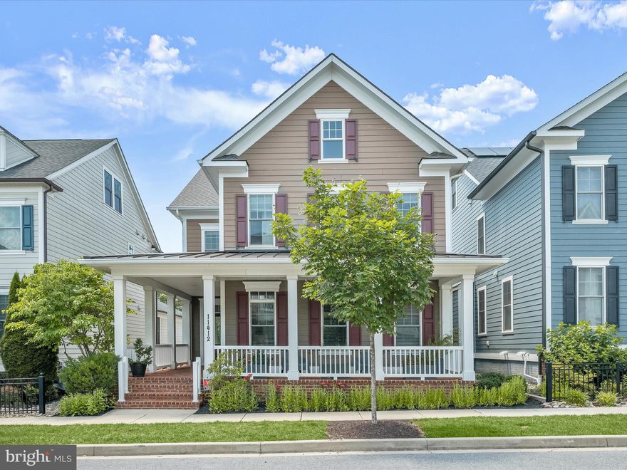 Welcome home to 11412 Dairy Street nestled in Maple Lawn’s highly coveted Garden District! This stunning 4-LEVEL Bozzuto “Sage” floorplan is loaded with high-end features including an energy efficient geo-thermal HVAC system, private courtyard, full-width front porch, coffered ceilings, white shaker-style cabinets, designer light fixtures, tankless water heater, and so much more. The main level features engineered wood flooring throughout, creating a warm and inviting atmosphere. The living room boasts coffered ceilings and a cozy gas fireplace, perfect for relaxation. The kitchen is a chef’s delight with white shaker-style cabinetry, a five-burner cooktop, Kitchen-Aid stainless steel appliances, and quartz countertops, complemented by a large kitchen island. The open-concept layout seamlessly connects the living, dining, and kitchen areas. The dining area is enhanced by French doors that open to a covered rear TREX deck which leads to a flagstone paver patio. The mudroom off the two-car garage provides the perfect family organization center, while the front of the home offers an office and a half bath.

The second level is designed for comfort and functionality featuring a primary bedroom with two walk-in closets and a luxurious primary bathroom equipped with a freestanding tub, dual sink vanity, and large shower stall. The second and third bedrooms each offer their own en suite bathrooms. The laundry room, complete with cabinetry and a laundry sink, is also conveniently located on this level. The third level offers a versatile built-out loft/bedroom with an en suite bathroom and a walk-in closet, ideal for additional living space or an extra home office. The lower level provides ample entertainment and guest accommodations with a spacious recreation room, a guest bedroom, and a full bathroom. Additionally, you’ll find an unfinished area for utilities and storage offering flexibility for future use. Conveniently located close to all major Baltimore/DC commuter routes, and with enviable amenities including a resort-style community pool, tennis courts, pickleball courts, basketball courts, state-of-the-art gym and more, you’ll quickly see why Maple Lawn is an award winning planned community unlike any other in Howard County.
