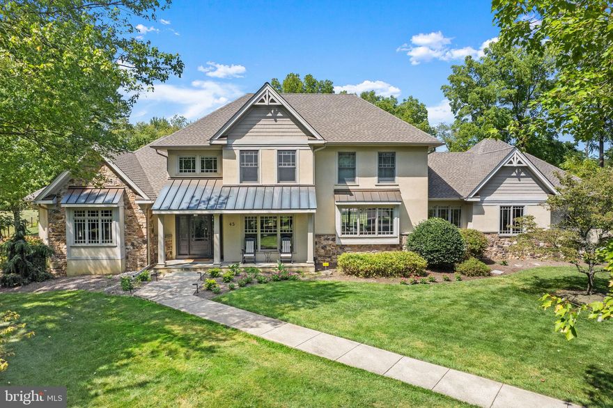 This beautifully inspired 4 bed, 3 full and 2 half bath home is truly stunning and shows like a designer model with thoughtful details blending seamlessly throughout each room. This custom home is rich in eye-catching millwork, moldings and architectural elements with one of the most striking features being the unique custom windows that add a level of design and style that elevate and impress. Offering an open floor plan while taking advantage of the abundance of natural light, the easy flow layout and generously sized rooms provide the perfect opportunity for entertaining and hosting family gatherings. The wide and airy foyer extends to the rear of the house, with built-in seating and hardwood floors that grace the majority of the main level including the formal living room adorned with a beautiful, coffered ceiling and wall of windows with picturesque views of the lush green front landscape. A double-paned glass door provides entry into the private front Study with two walls of craftsman styled built-in shelving and desk. The first floor Primary Suite offers convenience and luxury with 2 walk-in closets, soothing neutral colors and full bath with travertine radiant heated floors, soaking tub, 2 separate vanity areas and frameless shower. A sunken Gathering Room with gas fireplace, custom bookshelves and cabinetry for storage is at the heart of the home. Continuing the desirable flow, the neighboring breakfast area boasts a custom built-in buffet that is open to the Gourmet Kitchen. This is a gorgeous space featuring a striking marble-topped eat-in island, farmhouse sink, high-end appliances, stunning soapstone counters and tile backsplash. There is a corner nook off the kitchen offering a handy secondary office space with neutral cabinetry and desk. Completing this level is a mud room with bench/drop off zone with access to the 3-car garage plus a laundry room with sink and storage. On the upper level is a spacious Junior Suite with bonus room and huge walk-in closet, 2 bedrooms sharing a roomy, sunlit Jack and Jill bath with water closet and a walk-up attic perfect for storage. A finished lower level offers extended living space with entertainment game room, sitting area, half bath and large storage room with convenient garage access. The quiet cul-de-sac location provides the ultimate privacy with a mature tree-lined border and backing to farmland. Additional amenities include NEW gutters, NEW roof, NEW water softener and filtration system, NEW stairway runner, surge protectors, whole house generator, fresh carpet and paint. All of this in the award-winning Council Rock School District with convenience to the nearby towns of Newtown and Washington Crossing and the I-295 corridor for commuting. Truly one of a kind!