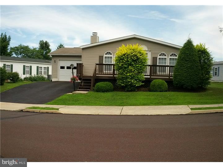 Former Model home. Beautiful fireplace in living room, Bright breakfast room, Ideal kitchen with skylight and pass tru to LR and DR, formal dining rm, spacious family room with sliding glass doors to nice size deck, 2 BRS and hall bath to the rear, large main bedroom with full wall of closets and bathroom has garden tub, skylight,shower, Lndry room is access to powder room and garage, drywalled walls, storage shed