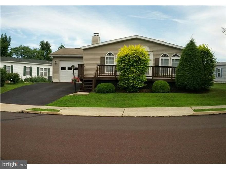 Former Model home. Beautiful fireplace in living room, Bright breakfast room, Ideal kitchen with skylight and pass tru to LR and DR, formal dining rm, spacious family room with sliding glass doors to nice size deck, 2 BRS and hall bath to the rear, large main bedroom with full wall of closets and bathroom has garden tub, skylight,shower, Lndry room is access to powder room and garage, drywalled walls, storage shed
