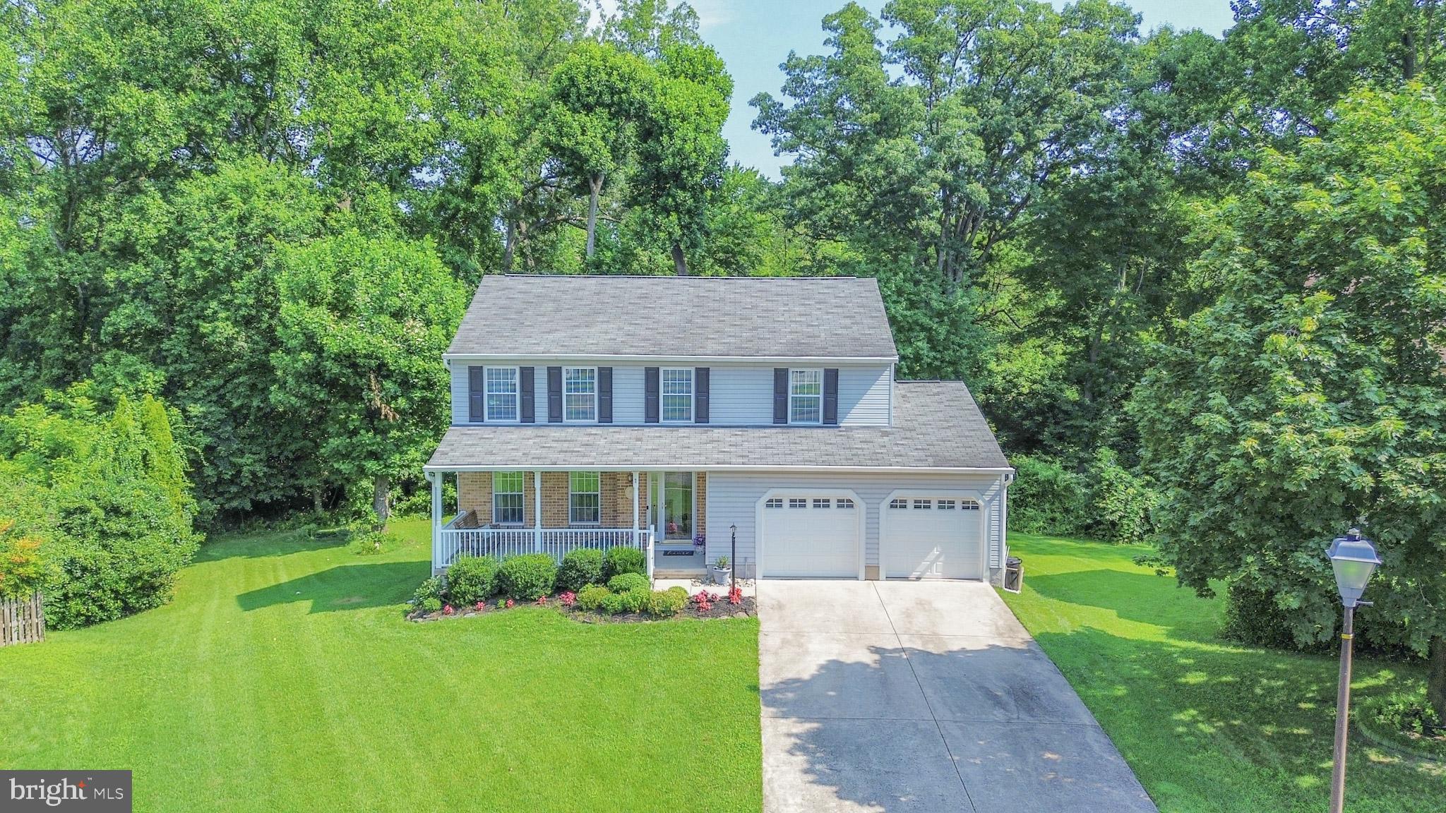 Nestled at the end of a quiet cul-de-sac and backing to serene woods, this meticulously maintained 4-bedroom, 2.5-bath colonial offers 3 fully finished levels of comfortable living space. A brick and siding exterior with covered front porch welcomes you into the light-filled foyer. The main level showcases a spacious living room with crown molding, a formal dining room with chair rail and crown molding, and a sprawling eat-in kitchen featuring updated stainless steel appliances, tile backsplash, and seamless flow into the family room with updated carpet, ceiling fan, and sliders to the rear deck.
Upstairs, the primary suite impresses with a walk-in closet, ceiling fan, and updated ensuite bath, while three additional spacious bedrooms and an updated hall bath complete the level. The finished lower level offers versatile living with a large rec room perfect for entertaining, a game room with slider access to the backyard, and a massive utility room providing abundant storage, laundry, and an updated high-efficiency HVAC system.
Step outside to your private backyard oasis—backing to trees—with a rear deck, above-ground pool with decking, covered patio, and storage shed. A two-car attached garage and thoughtful updates throughout complete this move-in-ready gem.