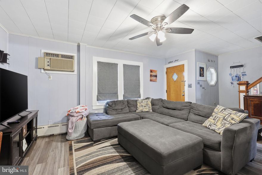 Located in the Harriman section of Bristol Borough, this charming and affordably priced home offers comfort, convenience, and the opportunity to make it your own. A welcoming front porch sets the tone — the perfect place to enjoy your morning coffee, unwind after a long day, or take in the neighborhood vibe.

Inside, natural light fills the traditional layout, which offers approximately 1,100 square feet of living space. The main level features a cozy living room, dining area, and kitchen designed for both everyday living and easy entertaining. Upstairs, you’ll find three bedrooms and a beautifully renovated full bathroom, providing functional and comfortable space for a variety of lifestyles.

The backyard offers a low-maintenance outdoor area ideal for summer evenings, grilling, gardening, or gathering with friends and family. A full basement provides additional storage and utility space, while public water, sewer, and natural gas service add everyday convenience.

Situated close to the Bristol train station, major roadways, shopping, the Burlington-Bristol Bridge, and the Pennsylvania Turnpike, this location makes commuting and daily errands simple while still offering the charm of an established neighborhood community.

Whether you're looking for your first home, downsizing, or searching for a property with potential and personality, this Bristol Borough home is full of opportunity and warmth.