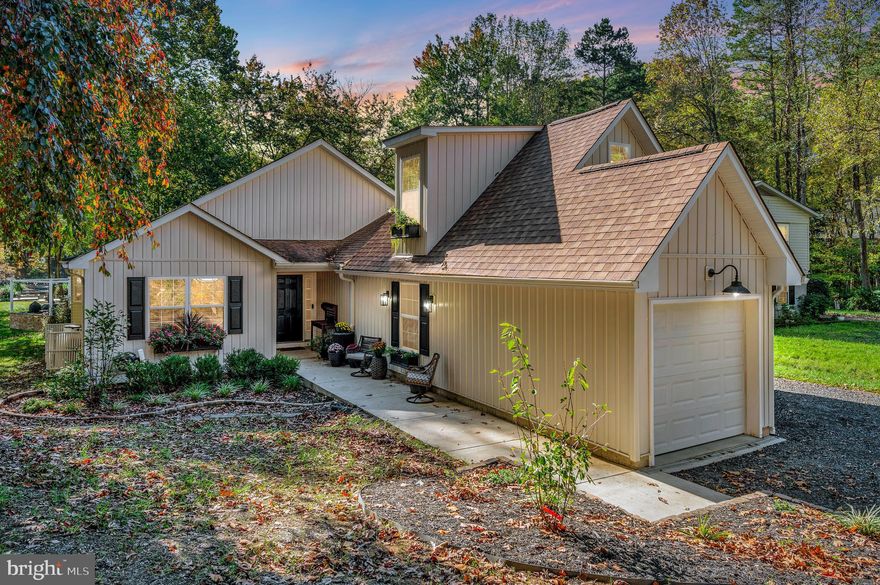 Welcome to this beautiful Keaton Lake waterfront in Lake of the Woods! This completely renovated 3-bedroom, 2.5-bathroom prow-style home blends modern comfort with breathtaking lake views and timeless charm.

Step inside the spacious foyer, where a built-in bench and coat hooks offer a warm and practical welcome. Kick off your shoes and get ready to fall in love with the details throughout this thoughtfully reimagined home. Laminate plank flooring stretches across the main living areas, tying the open-concept design together seamlessly.

The heart of the home—the farmhouse-style kitchen—features stainless steel appliances, a deep farm sink, gas cooking, and ample counter and cabinet space. It’s both beautiful and functional, ideal for the home chef or anyone who loves to entertain. The adjacent dining area and great room are bathed in natural light from the floor-to-ceiling windows and bay window with sliding doors, offering stunning lake views from nearly every angle.

The living room centers around a cozy gas fireplace, creating a serene balance of fire and water elements that make this space truly special.

All three bedrooms are conveniently located on the main level, including a spacious primary suite with two walk-in closets, a spa-inspired ensuite bath, and private deck access—the perfect spot to start or end your day overlooking the water.

You’ll also appreciate the centrally located laundry room, perfectly positioned near all the bedrooms for effortless access. This space includes built-in shelving for organization and a dedicated folding area, making everyday tasks both simple and stylish.

A home theater with bar area sets the stage for unforgettable movie nights, while the loft space currently serves as a home office—offering flexibility for your lifestyle needs.

Outside is where this property truly shines. Designed for relaxation and recreation, the wraparound deck, outdoor kitchen, patio with firepit, and picnic area by the water invite you to savor every moment. Spend your afternoons fishing, swimming, or sunbathing from your private dock, surrounded by peaceful lake views and the gentle sounds of nature.

Whether you’re searching for a full-time residence or a weekend retreat, 1206 Eastover Parkway delivers the ultimate lake lifestyle—modern, refreshed, and ready for your next chapter.

For added peace of mind, a one year Choice Home Warranty will convey to the new owner.

Nestled in a private, secure, gated community, Lake of the Woods is a paradise of possibilities. With two lakes, a golf course, an equestrian center, fire and rescue services, and even a church within its bounds, this community offers a diverse range of activities. From boating, water skiing, kayaking, and golfing to the simple joy of soaking in mesmerizing views from the clubhouse, deck, yard, or beaches, there's something for everyone. Engage your interests by joining over 60 clubs and organizations, or perhaps indulge in a game of bridge or contribute your talents as a volunteer. Lake of the Woods truly caters to your lifestyle.

Located in Orange County, enjoy the added advantage of low real estate taxes. With home prices spanning from $300,000+ to over $1,800,000, Lake of the Woods is the ideal haven for both full-time residents and weekenders. Don't just take my word for it – come and see for yourself! Allow me to guide you through a tour of Lake of the Woods, showcasing the very essence of what makes this community so special. Experience firsthand the captivating charm of Lake of the Woods!