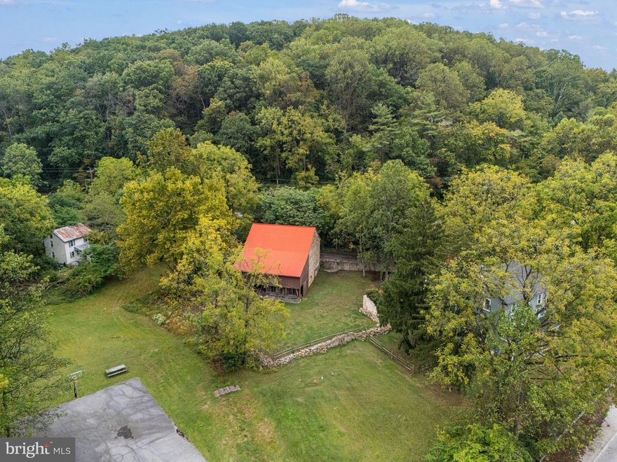 A circa 1795 Chester County estate with 11 acres, a 3 story farmhouse, separate 2 bedroom carriage house, large stone bank barn, sport court, and incredible flexibility in Downingtown, PA. 4701 Edges Mill Road offers the rare combination of acreage, character, privacy, additional living space, and convenient access to major routes, commuter options, shopping, dining, parks, and everyday amenities. The main home features 8 bedrooms or flexible bonus rooms, 3 full baths, 2 half baths, beautiful wood floors, exposed beams, multiple staircases, a renovated kitchen with granite counters and wood stove, formal dining room, parlor with custom bar, cozy family room, private office, upper floor laundry, and 6 fireplaces. The layout creates options for working from home, hosting long term guests, multigenerational living, hobby space, creative studios, or simply spreading out in a home with true historic presence.

The separate 2 bedroom carriage house has its own address, well, and newer septic system, creating added flexibility for guests, extended household needs, or possible rental income depending on buyer use and local requirements. Outdoors, the property is built for a lifestyle that is hard to find in a traditional neighborhood. Enjoy open lawn, mature trees, a fenced dog area, space for horses or chickens, a gazebo, and a full length sport court that can be used for basketball, tennis, or pickleball. The historic stone bank barn offers outstanding space for storage, equipment, hobbies, workshops, events, or future vision.

Buyers searching for a historic farmhouse for sale in Chester County, a Downingtown home with acreage, a property with a guest house, a home with barn and outbuildings, or a private estate with room to live, work, and entertain will want to see this one in person. Act 319 Clean and Green status may provide potential tax savings. Fiber optic internet, public water and sewer hook up availability, and convenient access to commuter rail, major routes, and the Chester County Airport add modern practicality to this one of a kind property. 4701 Edges Mill Road is more than a home. It is a rare Chester County opportunity with space, history, flexibility, and long term potential.
