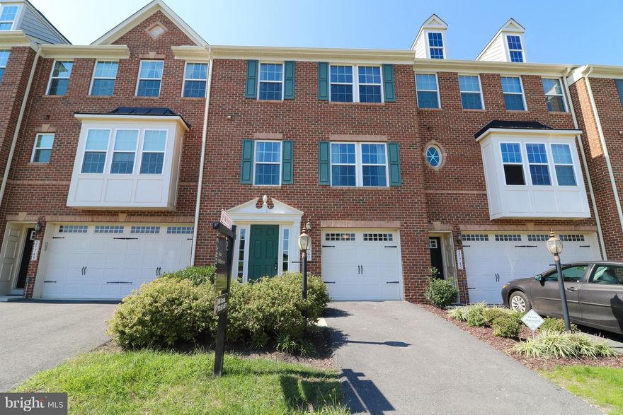 You will fall in love with this charming brick front town home with fresh paint throughout the entire interior and brand new, neutral carpet throughout. Gorgeous, expansive trex deck and fully fenced backyard provide perfect spaces for retreat or for entertaining guests. Garage with direct access to the home's Foyer. Best priced town home for the value in the neighborhood. Phenomenal location.