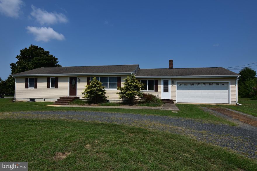 Welcome to 3610 Houston Branch Road, country living just outside of town.  This home has been well maintained and improved over the years, and is ready for the next owner to make it their home.  This is a traditional rancher with 3 bedrooms and 2 baths.  Large living room with stone wall gas fireplace on one end.  The kitchen is in great shape, with a cozy eat in area.  Sunroom or family room with separate laundry room as well.  Full basement, 2 car attached garage and large shed for plenty of storage.  The back yard has a screen porch attached to the house and a large pool with large 2 tier deck attached.  Newer septic and deep well.  All this on a .90 acre lot that backs to farmland for peaceful living.