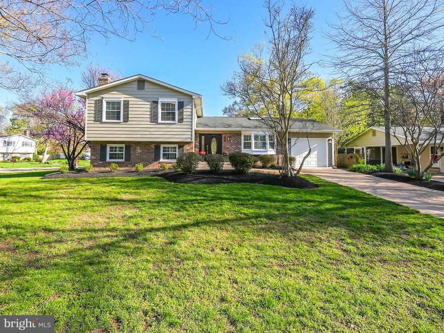 Modern, spacious, and beautifully updated—welcome to 2201 Wittington Blvd, a 4-bedroom, 3-bathroom, 4 level split boasting over 3,000 square feet of living  in the sought-after Sherwood Forest community. With no HOA, this home offers the perfect blend of a walkable community and suburban convenience, as this home is  nestled in a vibrant neighborhood with easy access to shopping, dining, parks, and public transportation. This lovely home  is just minutes to the Potomac River and beautiful Mt. Vernon , rich with our Nation’s history.
Step inside and be greeted by an inviting open-concept living space, where natural light pours in through skylights and glass. The  grand  living room seamlessly blends to the spacious  kitchen, which features  wood floors , rich dark wood cabinetry, granite countertops, stainless steel appliances and dual dining islands that make for spectacular entertaining that  Joanna Gaines would envy. The charm continues with a bright, all-weather sunroom that provides access  to the garage or the deck and flat quarter-acre backyard. Home opens to a double level deck and large hot tub , which shall convey.
Upstairs, the primary suite is a true retreat, boasting large windows, a dreamy walk-in closet with a custom organization system, and a welcoming  ensuite  bath with a double vanity and glass door enclosed whirlpool soaking tub  and shower combo. Modern lighting and two additional bedrooms with refinished hardwood floors with ample closet space share the hall bath featuring  a dual vanity, glass mosaic tile and tub. 
Lower level 1 is designed for both relaxation and entertainment. Just a few short steps from the kitchen  the  large recreation room features built-in shelving, a  fireplace with wood  insert  and custom plantation shutters. A generous private fourth bedroom with updated full bath makes this area ideal for visiting guests. The convenient laundry room, complete with a utility sink, storage closet, and folding counter, offers space for a potential mudroom and there is direct outdoor access to the hot tub area. 
This wonderful home does not stop there!  On the next level down, you will discover a versatile media room—perfect for those cozy movie nights. If film is not your thing  this gigantic room is perfect  for a home gym, dance space  or a  ‘leave the toys out’ playroom.
Surrounded with mature Crape Myrtles and fully fenced along the rear, you’ll enjoy Wittington’s prime location,as this home offers easy access to Old Town Alexandria, National Harbor, while those seeking the  vibrant Ft. The Hunt / Belle  community will appreciate nearby shops, restaurants, parks, and local activities. 
Commuters love the easy commute , 6 minutes to the bus top , 15 minutes to Ft. Belvoir , 25 minutes to National Airport and 30 minutes to the DC line via the GW Pkwy.