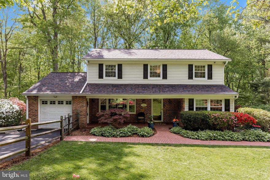 Hearts race, spines tingle, breaths quicken … Gather your cash, or grab that rate, invest in your nest! Rarely available in a small community, meticulously maintained and updated classic colonial home awaits!

Greeting you in the Spring are bright forsythias, magnificent magnolia, blazing azalea and fragrant lilac, shading you in the Summer is a large banana tree, dazzling you in the Fall are all the foliage in the woods ……If Thoreau lived now, he would live here!

Sip your morning drinks on the front porch, observe the wildlife from the balcony, al fresco dining on the deck, watch the flowers bloom 3 seasons, listen to the birds chirping and owls hooting, hike in the woods right behind the property… 

Formal living room with large window letting in natural light, dining room alongside the open kitchen providing gathering space, convenient laundry room by the side door, cozy family room opposite the living room. Primary bedroom suite has ample closet space, a dressing area and ensuite full bath. Hallway bath has dual entrances. 3 more good sized bedrooms plus an over the garage storage area round up the upper level. Basement has a spacious rec area completed with wood burning stove and a kitchenette/bar area. The 3rd full bath provides any guests with convenience. Unfinished space is your workshop or gym.

Located in a sought-after community with fantastic amenities including a swimming pool and sports courts, and just minutes from shopping, dining, entertainment, and major commuter routes. Hurry, do not let this gem slip away! 

Roof: 2024, HVAC 2018, side deck refurbished: 2025. Home Warranty included!!