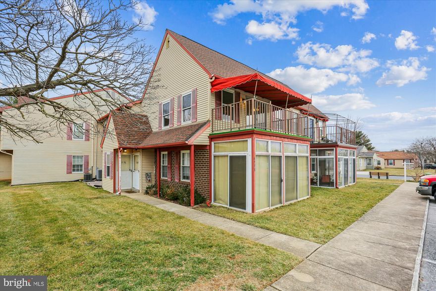Fabulous two-bedroom, pet-friendly, corner second-floor unit in the highly sought-after 55+ active adult community of Crestwood Village.  This home features a covered front porch with assigned parking right outside the front door.  Recent renovations include custom painting, new luxury vinyl plank (LVP) flooring, remodeled kitchen and bathroom, upgraded lighting throughout, and vinyl replacement windows.  Side door entry into foyer with staircase to upper level; living room with sliding glass doors to covered front porch; dining area with ceiling fan over table area; kitchen with painted cabinets, quartz countertops, under-mount sink, upgraded stainless steel appliances, stainless cabinet hardware, and new lighting; coat, storage, and linen closets in hallway; two bedrooms with neutral carpeting and large closets; remodeled bathroom with 12-inch ceramic tile flooring, tub with ceramic tile wall surround, oversized vanity with solid surface countertops, integral sink, and new vanity light; laundry room with h/e, full-sized, stackable washer and dryer. Crestwood Village’s outdoor amenities include a community pool, a miniature golf course, tennis courts, and shuffleboard.  Additionally, there is a gorgeous clubhouse featuring a computer room, library, fitness room, locker rooms with saunas, pool tables, table tennis, kitchen, and several meeting rooms. Located minutes from downtown Frederick, as well as multiple local shopping centers, with a community shuttle bus making scheduled runs to each. Low HOA and condo fees total $354 per month and cover exterior maintenance, lawn care, trash removal, basic cable TV, and security.