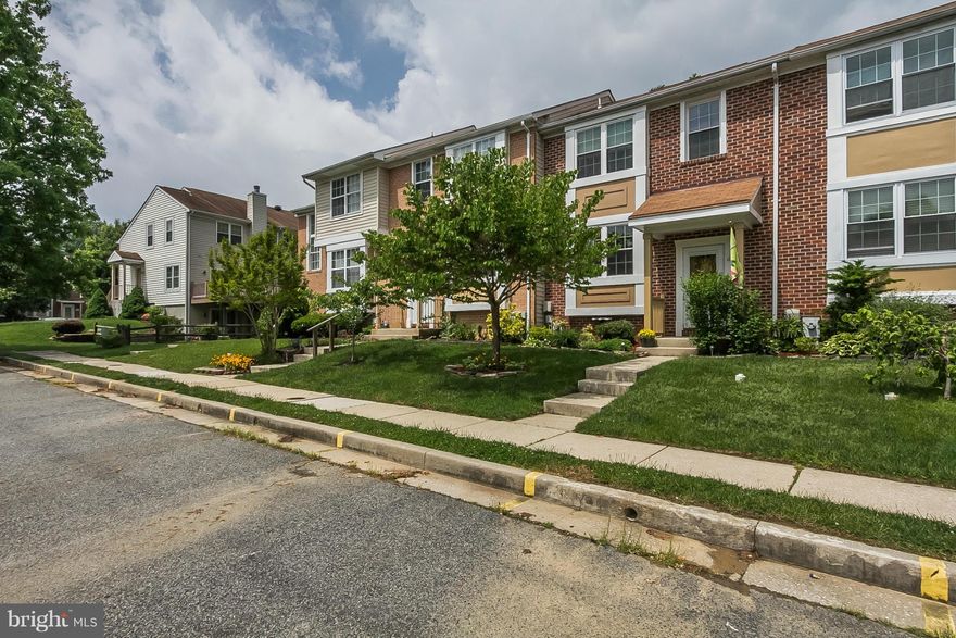 This spacious 3 bedroom 2 1/2 bath townhouse is move in ready.  The updated eat in kitchen offers granite and beautiful cabinets.  Cozy living room features beautiful hard wood floors and a fireplace and walks out to deck in rear.  Master suite with full bath and great closet space.  Fully finished walk out lower level offers a rec room and lots of living space.