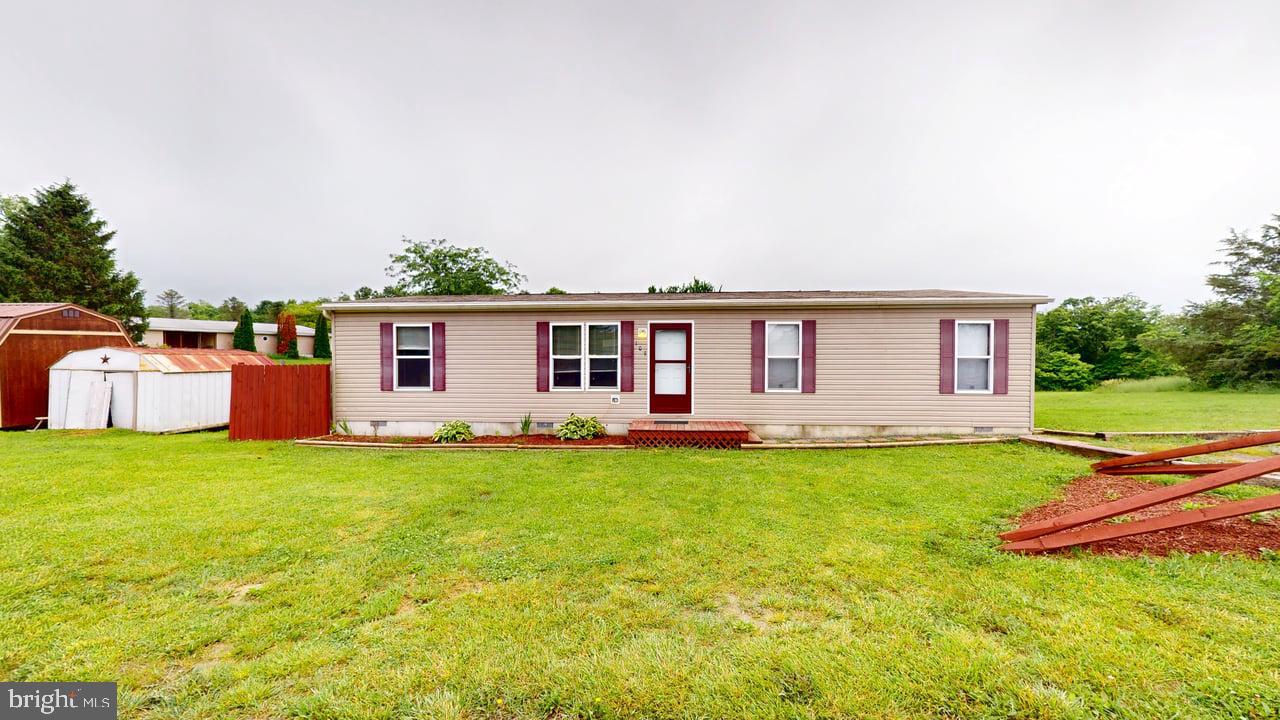 Discover peaceful country living with this well-maintained 3-bedroom, 2 bath manufactured home situated on a spacious 1-acre lot in scenic Augusta! Offering both comfort and convenience, this home features central A/C, public water and sewer, and is located on a state-maintained road for easy year-round access. Inside, you'll find a bright and open floor plan with generous living space, a functional kitchen, comfortable bedrooms and a bonus room that could be converted to a fourth bedroom! Step outside to enjoy the wide-open yard-perfect for gardening, recreation, or simply soaking up the mountain air. Just 45 minutes to Winchester, VA, this property is ideal for commuters, weekenders, or anyone looking for a quiet retreat with easy access to town. Don't miss your chance to own a slice of West Virginia tranquility-schedule your showing today!