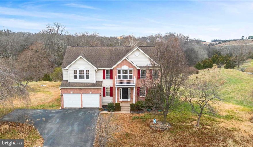 Looking for a home with lots of space inside and out? Then this one is for you!
This home boasts 2500 square feet of living space – 4 bedrooms, 2  ½ baths – closets galore, plus a full, walk-up basement and attached 2-car garage. The .40 acre lot borders a common area that provides extra privacy and elbowroom.
The main level features a two-story foyer and a formal living room that can also be a great home office. The separate dining room overlooks the wooded common area behind the home. The kitchen opens to the breakfast area and family room. A half-bath and the laundry/mud room round out this level. You also have access to the large back deck to expand your living and entertaining area even further.
Upstairs, you will find four nicely-sized bedrooms and a hall bath. The primary suite has a vaulted ceiling, a huge walk-in closet, and connects to the primary bath that features a vanity with double sinks, a soaking tub, and a separate walk-in shower.
New carpet, fresh paint, and recent cleaning have made this home move-in-ready and available now.  Nestled in a quiet neighborhood just minutes from Route 9 and situated nicely between Martinsburg and Charles Town.