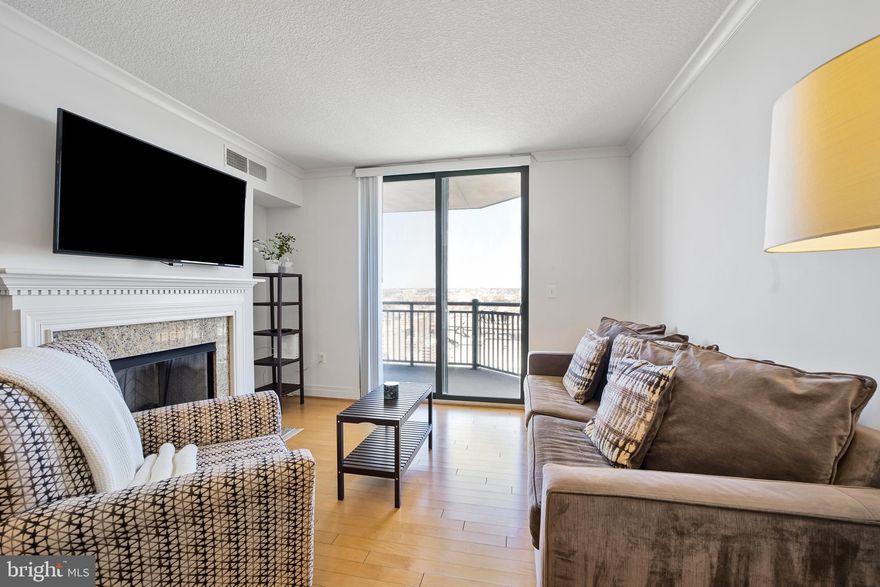 Stunning 2-bedroom, 2-bath condo perched on the 26th floor of the highly sought-after 414 Water St. building offers an exceptional lifestyle just blocks from the Inner Harbor. Step inside to a sun-filled open floor plan, where brand-new hardwood floors (2025) and expansive windows create a bright, inviting atmosphere. At the heart of the home, the chef’s kitchen is a true delight with ample cabinetry, granite countertops, a two-tier island with breakfast bar, and stainless steel appliances. The dining area flows effortlessly and the spacious living room with a cozy gas fireplace sets the perfect backdrop for both relaxing evenings and entertaining guests. Two generously sized bedrooms each featuring large closets and private en-suite baths, offer comfort and convenience. An in-unit laundry closet adds to the ease of daily living. Step out onto your private balcony to enjoy sweeping city views, the perfect spot for morning coffee or winding down. The pet-friendly 414 Water St. community boasts an array of amenities, including secure entry, an outdoor pool, fitness center, business center, and resident lounge. An assigned parking space (with monthly fee) and secure 3’x5’ storage unit are also included for added convenience. All of this in a prime downtown location, just blocks to Shot Tower Metro, Whole Foods, and the best of Baltimore’s attractions, from the Inner Harbor and National Aquarium to M&T Bank Stadium, Oriole Park, BWI, and more. Don’t miss the chance to make this exceptional home yours!