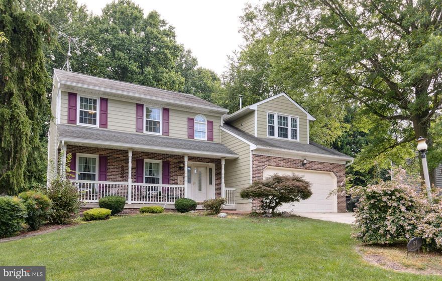 Are you searching for a stunning 5 Bedroom/3.5 Bath Colonial with brick facade and Hardie Board siding with Front Porch?  Your search is over! Every detail has been thought of and attended to here!  Over $250,000 of improvements in 2016 alone; Kitchen, Bathrooms, Flooring, Hardie Board Siding, Gutter, Tankless Water Heater, Windows, LL Carpet!  Come home to the oversized island with built in microwave beneath beautiful Cambria Quartz countertops, all stainless appliances including double ovens, full size refrigerator and freezer, cooktop, custom subway tile with glass accent backsplash, upgraded Kitchen Aid cabinetry and full wall of pantry cabinetry to hold all the extras and that is just the remodeled Eat-In Gourmet Kitchen!  2 Story Foyer with recent hardwood staircase; crown molding, chair rail and custom moldings you will find throughout the main level as well as hardwood flooring.  Spacious Formal Living Room with lovely lighting flows seamlessly into the Kitchen; a half wall between the Kitchen and Family Room which is perfect for serving family and guests at large gatherings; Family Room features Gas Fireplace with gorgeous brick surround and mantle and don’t forget about the custom-built shelving, perfect for extra storage.  Improved Half Bath featuring wall to ceiling glass tile wall, recent cabinetry with glass bowl sink and new lighting; 1st floor Laundry/Mudroom with utility sink both areas have marble tile flooring.  Upstairs, you will find the Primary Master Suite which has everything you have dreamt of, the seller have created an true oasis - The spacious Primary Bedroom has an impressive custom built walk-in closet with organizational system and cabinetry and a cozy sitting area with stack stone hearth and mantle for pellet stove, the room also has a mini split heating and cooling system so you can determine the temperature; the stunning Master Bath features a spacious seamless glass shower with seat, multiple shower heads (w/rainfall ceiling shower head), large super jetted soaking tub with gorgeous chandelier above, custom tile surround, heated radiant flooring, dual vanities with gorgeous floor to ceiling cabinetry and glass sinks. Nothing has been missed in this Master Suite!  Additional 3 upper-level bedrooms are generous in size, offer good closets space and new carpeting installed (2022).  Two of the bedrooms have electric fireplaces.  The Upstairs Hall Full Bath is not your typical Hall Bath!  Featuring the custom mosaic design in shower and tile wall, seamless glass shower and multiple shower heads; upgraded vanity and lighting. The walkup fully finished lower level welcomes a 2nd Family Room, Recreation area, 5th Bedroom and Full Bath. Recent HVAC (2015), Tankless Water Heather (2016), Mini Split System (2020).  The 2 Car Garage with AC & Heat has customized flooring covering (2020).  Outside of this home is as impressive as the inside with large deck with flower boxes, screened-in porch, and access to fully fenced treelined backyard.  This home is truly the perfect package!  Be ready to call it home today!  Don’t forget to see the full list of recent upgrades and improvements.  Call to schedule your private showing!