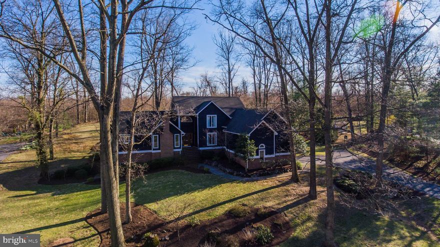 Beautiful, well maintained home tucked away at the end of a cul-de-sac. Master bedroom and additional bedroom on the main floor, each with a private full bath.  2 fireplaces.  Large mostly finished basement.   2 brand new water heaters, newer washer and dryer. Extra refrigerator and freezer in garage convey.  Acreage and square footage are an estimate.