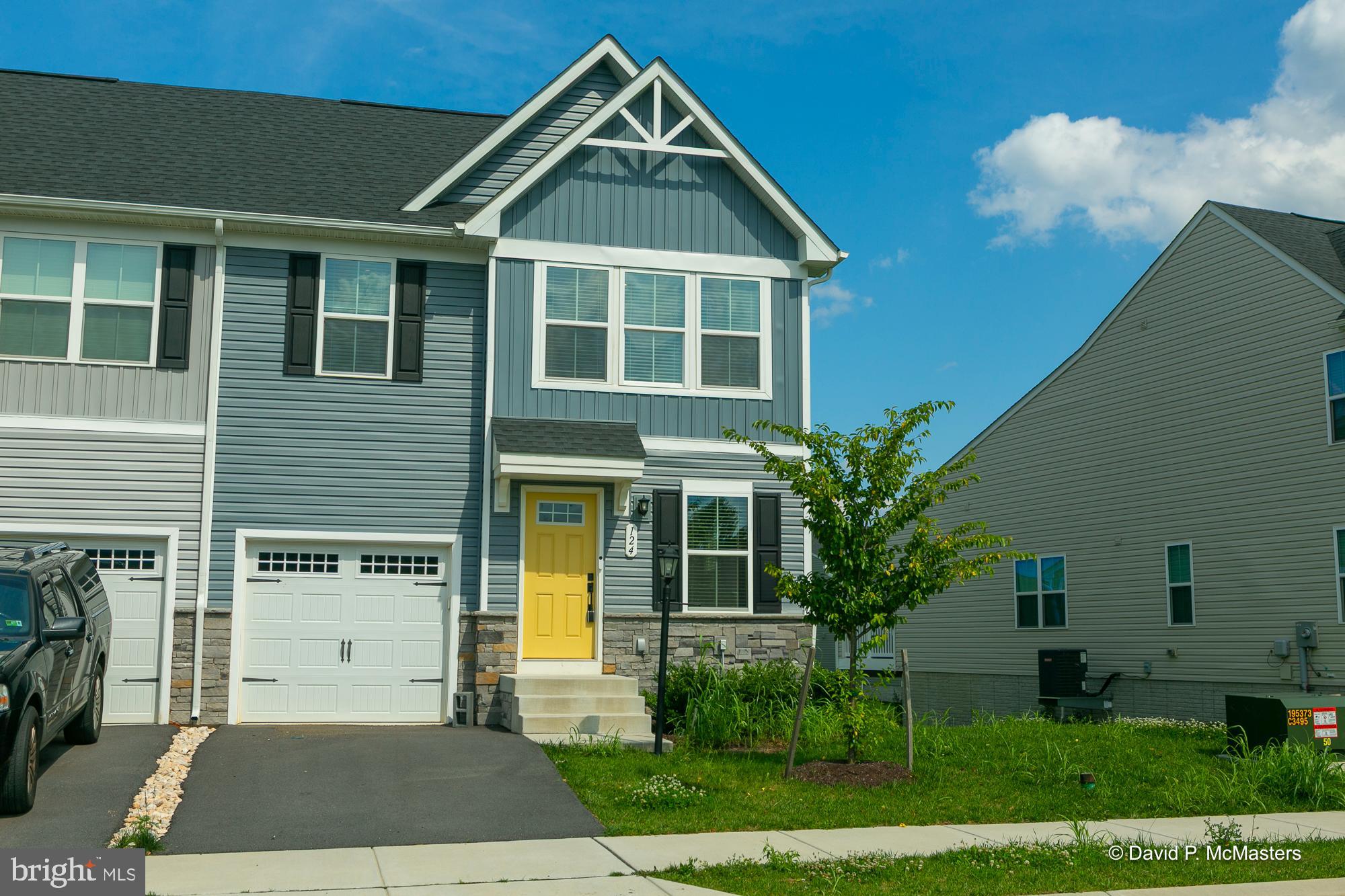Discover this beautifully maintained townhome/villa, just two years young and filled with modern finishes and thoughtful design. Step inside to find durable and stylish luxury vinyl plank flooring throughout the main living areas and an inviting open-concept kitchen and dining space. The kitchen features gleaming granite countertops, a breakfast bar perfect for casual meals, and stainless steel appliances. The main level primary suite offers comfort and convenience with a tiled walk-in shower, double vanity, and a spacious walk-in closet. Upstairs, you'll find two generously sized bedrooms, each with their own walk-in closet, providing ample storage. The full, unfinished basement includes a bath rough-in and opens to a covered concrete patio, perfect for outdoor entertaining. There is also a covered deck just outside of the kitchen, where you can relax rain or shine. Don't wait for new construction – this like-new home could be yours today!
