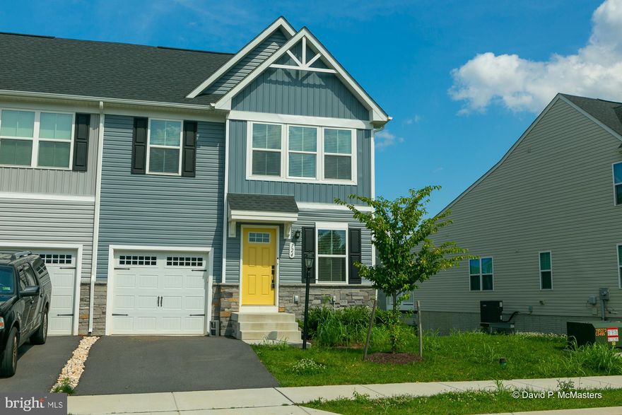 20k price reduction!!! Discover this beautifully maintained townhome/villa, just two years young and filled with modern finishes and thoughtful design. Step inside to find durable and stylish luxury vinyl plank flooring throughout the main living areas and an inviting open-concept kitchen and dining space. The kitchen features gleaming granite countertops, a breakfast bar perfect for casual meals, and stainless steel appliances. The main level primary suite offers comfort and convenience with a tiled walk-in shower, double vanity, and a spacious walk-in closet. Upstairs, you'll find two generously sized bedrooms, each with their own walk-in closet, providing ample storage. The full, unfinished basement includes a bath rough-in and opens to a covered concrete patio, perfect for outdoor entertaining. There is also a covered deck just outside of the kitchen, where you can relax rain or shine. Don't wait for new construction – this like-new home could be yours today!