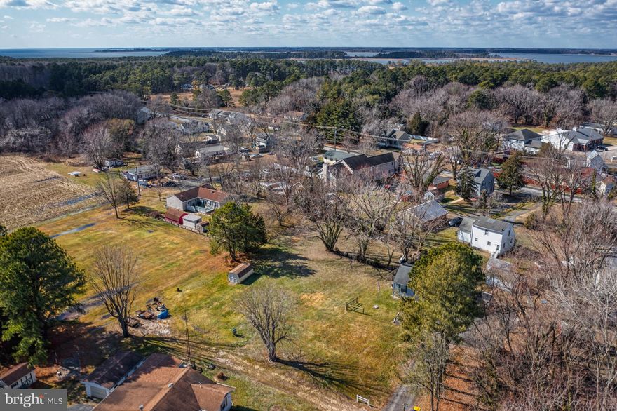 Nicest Building lot available in Grasonville. Level, clear, no wetlands ready to build homesite that backs to open space and planted field in summer. This larger, over half acre lot, allows room for an additional garage, shop, pool, outdoor living space, etc. Also includes active sewer account, no Tap Fee! No Traffic, but 1 Block to Main St., 2-3 minutes to US 50 E&W and centers of employment. Access easement for 119 Church Ct. Where gravel drive is.  For Builder, Investor Buyers, this lot is also a potential 2 lot subdivision, plat is ready to submit to county! Reasonable, non-contingent cash offers considered.