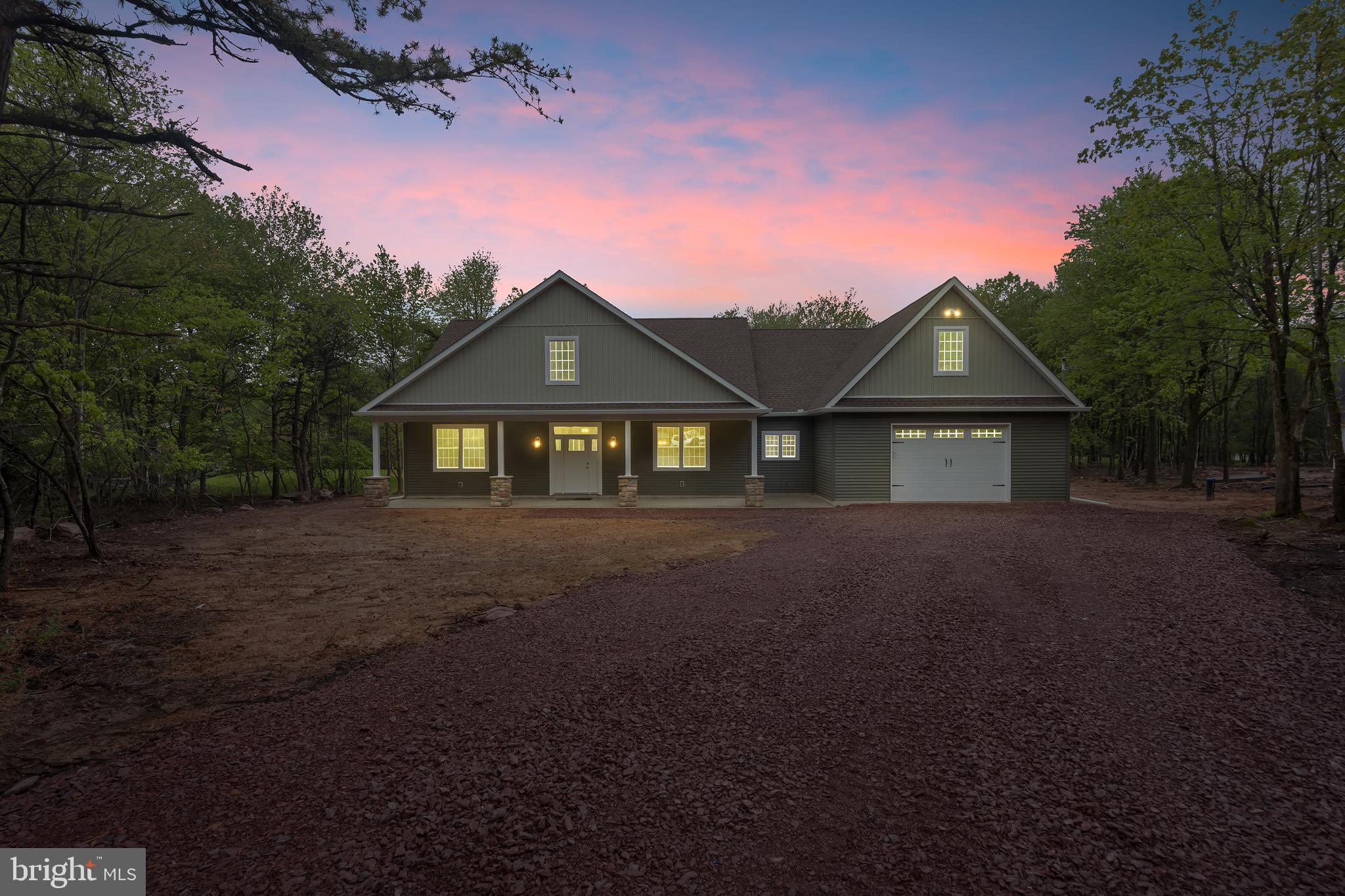 Not like the other! This stunning home sits on a one acre lot at the end of a cul de sac and features 4 bedrooms and 3 1/2 baths, but is so spacious it can easily sleep 12 or more and still have plenty of room to move around! All the bedrooms feature walk in closets, ceiling fans and have plenty of natural light. There are two en suites for complete privacy and all baths are tiled. The great room is open to a large dining area and the kitchen. Oversized sliding doors bring more of the outside in, but the spacious patio is waiting for your grill and hot tub. There is a separate formal dining room which could easily be an office or 5th bedroom (the bldr will be happy to close it off for you). The kitchen is a showstopper! Nothing builders grade in here. there are upgraded cabinets with soft close hardware, gorgeous quartz countertops, a chic tiled backsplash, stainless steel appliances and a large walk in pantry closet. The primary suite is filled with natural light and has a bathroom so large you'll wonder where it ends! Make sure you check out the relaxing steam shower. This level also has a powder room, laundry room ,several storage closets and an entrance into the two car garage with even more storage and ample parking. We're not finished- The upper level greets you with a full tiled bath and a very large bedroom that the kids will want to fill with bunkbeds and a play/game area, but your guests could use as a private retreat. Come appreciate over 3000 sq ft of beautiful living in a fabulous lake community with many amenities!