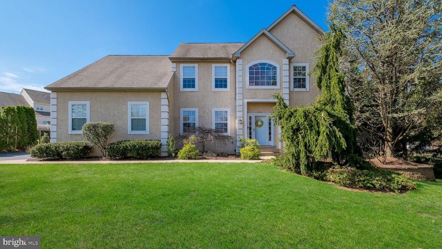 Beautiful 4 BR, 2.5 Bath custom-built Colonial situated on a half acre lot with mature trees and landscaping! Formal 2-story entry with large arched window over front entry door, a turned Staircase with oak treads and painted risers & hardwood flooring that flows into the Kitchen and Breakfast room. French doors from the Foyer open to a first floor office with wall-to-wall carpet. Across the Foyer the formal Living room offers wall-to-wall carpet that continues into the formal Dining room with chair rail, picture molding & a custom tray ceiling with crown molding. The large eat-in Kitchen features a center island/breakfast bar with seating for 2, stained maple cabinetry, recessed lighting, solid countertops, stainless steel appliances including built-in dishwasher, gas range with built-in overhead microwave. The Kitchen overlooks the Breakfast room with a sliding glass door leading to a composite deck with retractable awning overlooking the private rear yard. Half wall from Breakfast room to Family room with wall-to-wall carpet, marble gas fireplace & cathedral ceiling with ceiling fan & recessed lighting. The first floor also offers a half bath & Laundry room with built-in cabinetry with access to the 2 car side entry Garage. Turned oak staircase leads from the Foyer to the 2nd level featuring a Primary Bedroom Suite with wall-to-wall carpet, cathedral ceiling with ceiling fan & recessed lighting, walk-in closet, separate sitting room & Primary bath with corner jetted tub. walk-in tiled shower & double vanity. 3 additional large bedrooms with wall-to-wall carpet plus full hall bath with large vanity & tub/shower combination. Full, unfinished Basement. 2 Car side entry garage. Newer high-efficiency gas heat & C/A. Deep back yard. Premium  hardwired stereo speakers in the Family room, Kitchen, Dining room and Primary Bedroom. Meticulous inside and out!