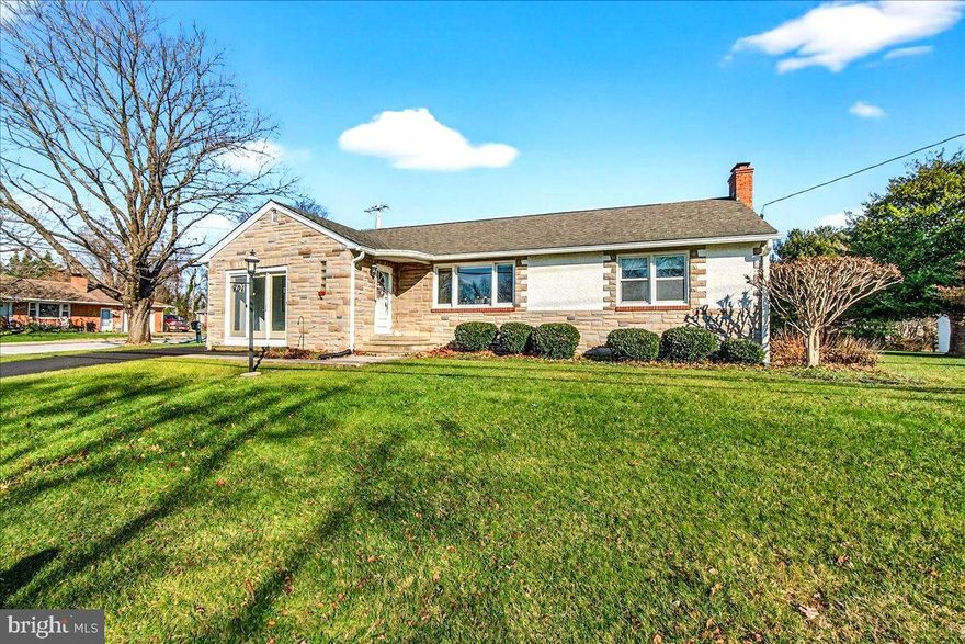 Welcome home to this meticulously cared for 1950’s rancher situated on a near half acre corner lot and conveniently located within easy walking distance to Mount Airy’s Historic Main Street, city parks, shopping centers, post office, swim club, senior center & public library. 

Inside features a surprisingly open floorplan with spacious, light-filled living areas, original hard wood floors and custom period touches like arched entryways, large picture windows and stained wood trim and doors. There’s a versatile addition that can serve as a 4th bedroom, a family room or could be perfect for a home occupation. The laundry has been moved to the main level convenient for one level living. A spacious lower level is ready for finishing and offers a beautiful wood-burning fireplace and rooms for storage. Please note that the home has central air conditioning, the wall unit pictured is secondary.

The exterior really shines. Charming stone veneer and beautiful landscaping add great curb appeal while covered porches and rear patio provide multiple outdoor spaces to enjoy. There is a large detached two-car garage with storage above along with multiple driveways providing plenty of off-street parking. 

Recent upgrades include an architectural shingle roof, insulated windows, refinished tub/shower, fresh paint and an upgraded electric service panel providing peace of mind for years to come. Law office of Patricia A. McKenzie preferred for settlement. Some photos have been virtually staged.