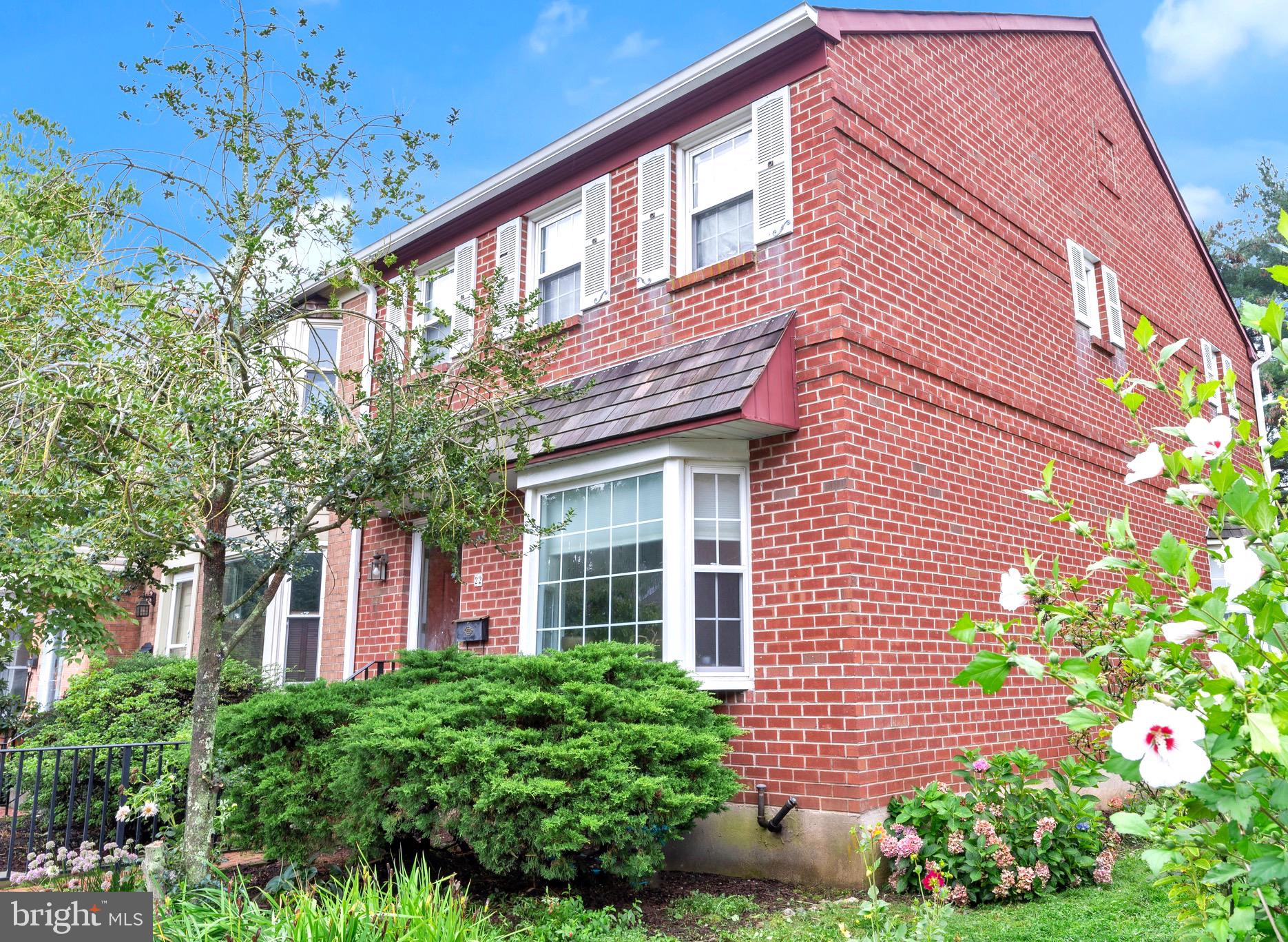 Showings Start Sunday August 17th at 12pm and an open house from 1-3pm! Welcome home to this rare and charming end-unit townhouse in Olde Colonial Greene, located just minutes from Doylestown Boro! From the classic brick façade, step inside to a spacious living room flooded with natural light, where rich hardwood floors and a fireplace with a newer wood burning insert, create instant warmth. The two-sided hearth separates the living and dining areas- offering cozy ambience and awesome heat source in the living room and a welcoming focal point in the dining area that features a beautiful bay window, perfect for plants, photos, or soaking in the sunshine and newer sliding glass door to a lovely screened-in porch- ideal for morning coffee or relaxing summer nights. The kitchen features a granite breakfast bar in and wonderful cabinet and counter space, ready for cooking and enjoyment. Upstairs, newer hardwood floors continue throughout 3 bedrooms, including a large primary with a private full bath; and 2 bedrooms share a hall bath that offers a fresh touch with a new vanity. The partially finished lower level provides flexible space and features extra unfinished storage area and Bilco doors that open up conveniently to the side yard. 2 parking spots included. All of this just minutes from the heart of Doylestown’s shopping, dining, parks, and museums- and in award-winning Central Bucks Schools! Schedule your appointment for 22 Gatehouse Lane today- charm, comfort and convenience await!