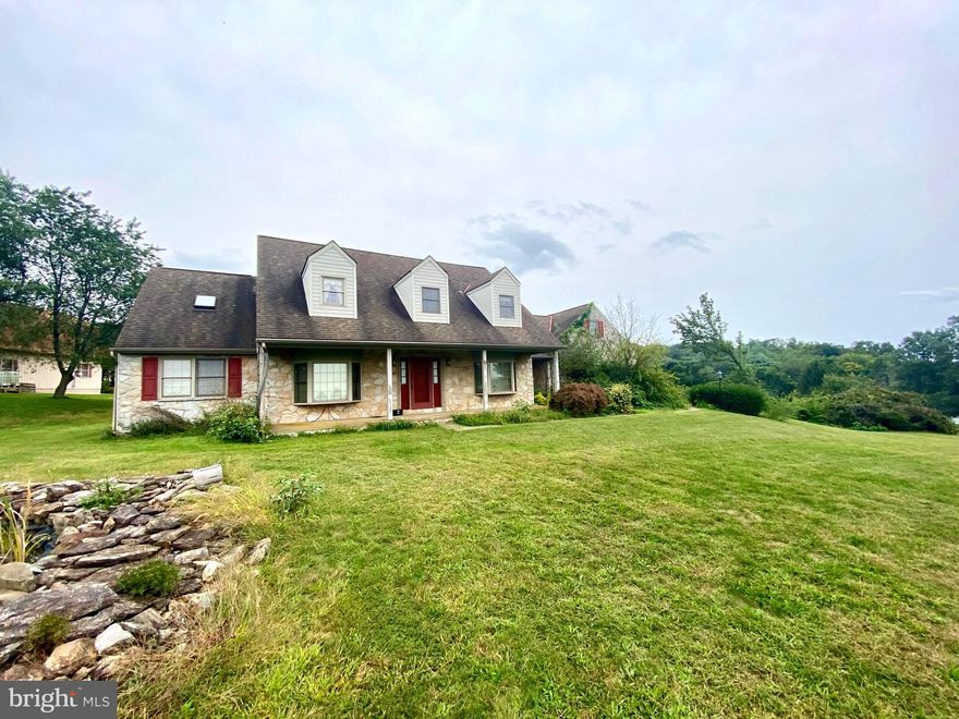 Money making opportunity.  Watch the equity grow while you complete the cosmetic upgrades to bring this home to its prime!  So much potential with over 4 acres of land and breathtaking views.  Prestigious tree lined drive way, and spacious cape cod style home with a main floor suite.  Vaulted ceilings, wood floors, built-ins, open foyer and lots of windows offering plenty of natural light.