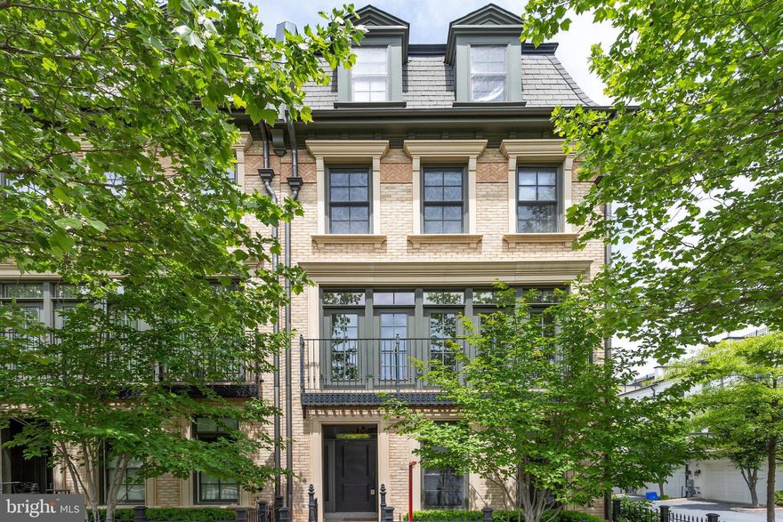 Discover this stunning end unit townhouse in the highly desirable, award-winning neighborhood of Symphony Park, filled with natural light from its many windows.  This home is nestled on a quiet street between two beautifully landscaped parks, and offers 5 spacious bedrooms and 4.5 bathrooms across 4 levels along with elevator access. Enjoy fresh paint throughout and a gourmet kitchen featuring Viking appliances and new quartz countertops. The new carpet adds comfort, while the 2-car garage and additional driveway parking provide convenience. There are guest parking spaces right in front. Step outside to a deck off the kitchen or relax on the rooftop terrace. This property boasts upgrades like 3 bump-outs and custom built-in cabinetry in the dining and living rooms. The main level and owner's suite on the third floor have beautiful hardwood flooring. Plus, you're just a short walk from Grosvenor Metro, Strathmore Music Center, Starbucks/cafes, and Whole Foods.  A quick drive to vibrant shopping and dining options at Pike and Rose and Bethesda Row.