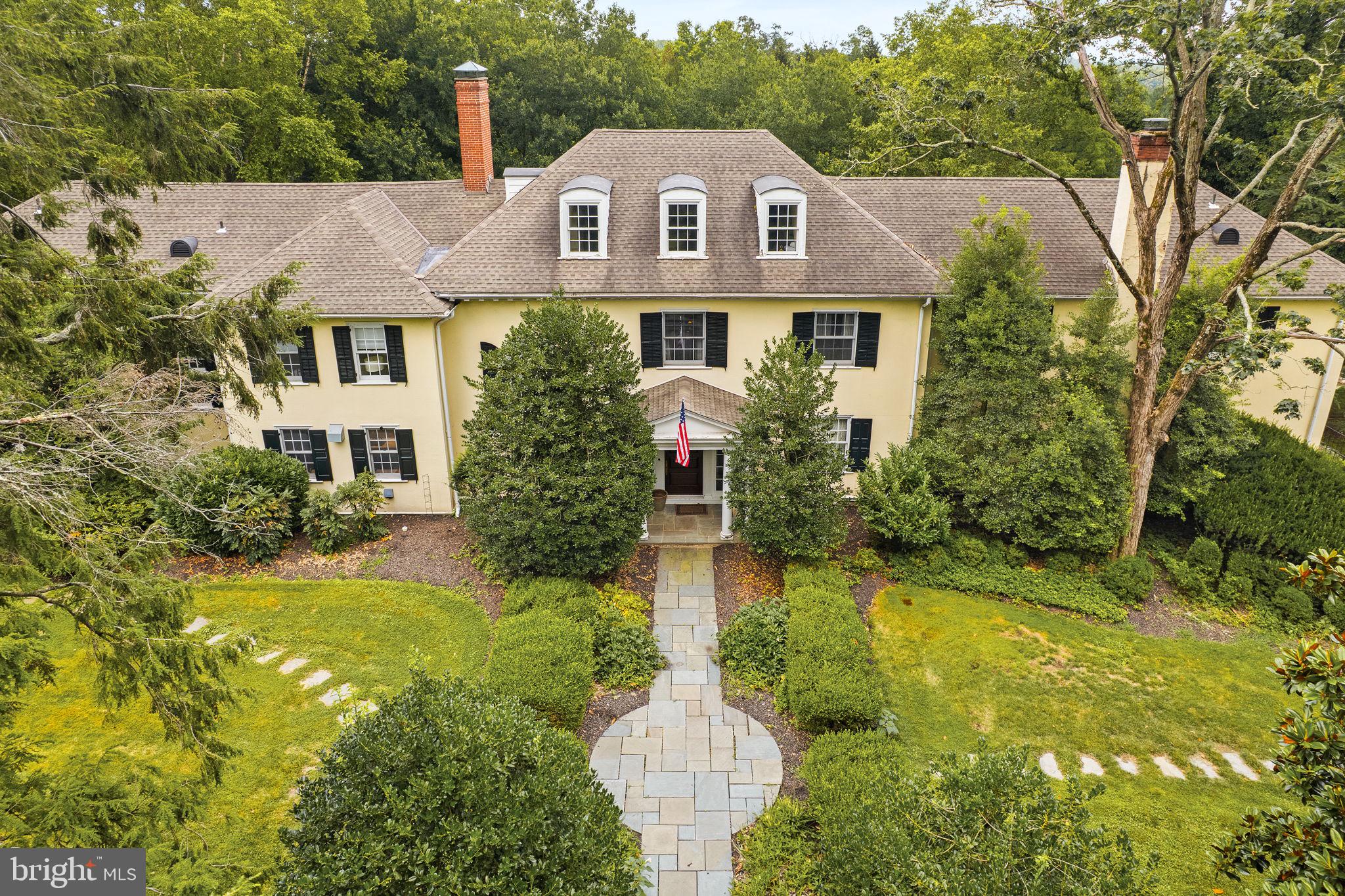 Exquisite 5-Acre Estate in the Heart of Lower Gwynedd (please see floorplans at the end of the photo library)
6 Bedrooms | 5 full & 2 half Bathrooms | Finished Basement | 4-Car Garage | Sport Court | Expansive Lush Yard | Generator | Private Drive
Set at the end of a long private driveway, this magnificent 5-acre estate in Lower Gwynedd offers exceptional privacy, timeless elegance, and an unmatched lifestyle. Surrounded by mature trees and professionally designed landscaping, this custom home was built with every detail thoughtfully curated.
Enter a grand 2-story foyer with a sweeping staircase and elegant moldings. There is a formal powder room with marble floors and a second powder room conveniently located near a side entrance off the driveway.
The 1st floor features quarter-sawn hardwood floors with custom walnut inlays, creating a refined and cohesive flow. The family room is a showstopper, with skylights, built-in cabinetry, and soaring double-height windows. French doors open to the expansive flagstone patio, which is also accessible from the formal dining room, library/study, and eat-in kitchen—each room offering elegant transitions between indoor & outdoor living.
The chef’s kitchen is outfitted with premium appliances, abundant prep & storage space, and dramatic two-story windows. A set of walk-out French doors adds seamless flow to the outdoor entertaining areas. The formal dining room can accommodate large gatherings, while the library features custom mahogany built-ins and another set of French doors to the patio. A richly appointed living room completes the main level, evoking a cinematic ambiance with its scale and finishes.
Upstairs, the home offers six generously sized bedrooms, each with its own on-suite bathroom. One pair of bedrooms shares a Jack and Jill bath, perfect for siblings. The primary suite is a true retreat, featuring custom built-ins, ample closet space, and a spa-inspired bathroom with soaking tub, walk-in steam shower, and 2 vanities. A large second-floor laundry room adds functionality and convenience.
The 3rd floor provides even more flexibility, featuring a spacious bedroom, 4-piece bathroom, a sitting area, and ample storage—ideal for an au pair or guests.
The fully finished basement has more living space, with a home gym, game room, media center, & hobby area.
Outdoors, enjoy a fenced sport court with both tennis and basketball, and a covered Palladium structure, and professionally installed putting green. Additional outdoor features include flagstone walkways, a stone courtyard, and lush gardens that surround the home in natural beauty.
This exceptional property is also equipped with a whole-house generator, five-zone heating and cooling, a wired alarm system, and a Cartell driveway alert system that notifies you when vehicles approach—offering the ultimate in comfort, security, and peace of mind.
A 4-car garage provides ample parking and storage, and the entire home has been lovingly maintained and thoughtfully upgraded.
Ideally located in one of Montgomery County’s most prestigious communities, this estate is just minutes from award-winning schools, fine dining, shopping, golf courses, and major commuter routes—offering the perfect blend of luxury, privacy, and convenience.