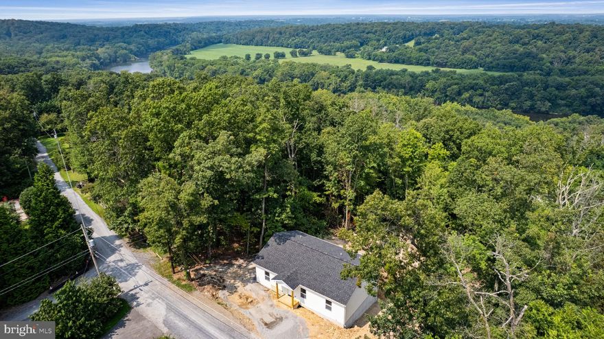 Welcome home to this almost completed new construction rancher - 327 Red Bird Ln, Harpers Ferry WV!! Main Level Living at its finest - In the heart of the home you'll be greeted by Vaulted Ceilings+ LVP Flooring throughout the Open Family Room flowing into Beautiful Kitchen w/ Island and table space, on one side of the home you'll find the Primary Suite with walk in closet, en suite full bathroom with tub shower combo and linen closet; On the other side of the home are 2 nicely appointed bedrooms and Full bath. Bonus to this home is the laundry room is located on the main level! Lower spacious walk out basement offering additional space, and storage. High Speed Internet! No HOA! Great location, low maintenance home, low taxes! Easy access to Virginia and Maryland. Close to an arrange of community actives / amenities - Mountain Lake Club and Beach , River Country Store, Shannondale Springs Trails, Mount Mission Park; as well as stopping, entertainment, history, nature an so much more! *** photo show alike fixtures and finishes for the home