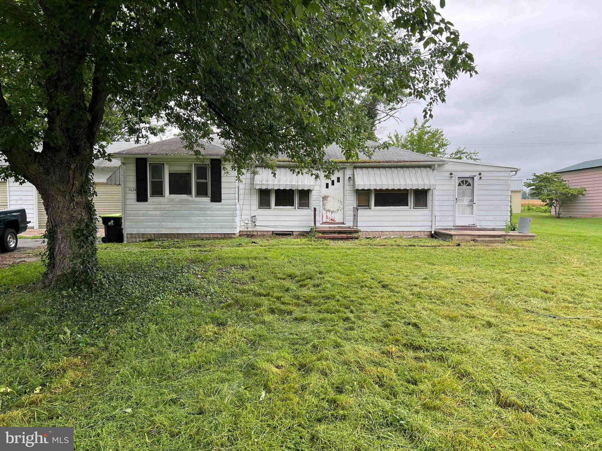 Two bedroom, two bathroom home situated on over half an acre of land awaiting your personal touches.