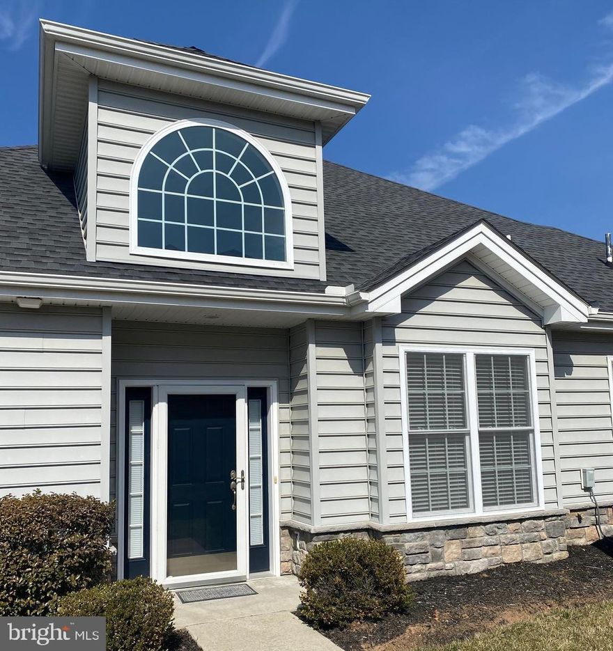 CONTEMPORARY style with a CHIC ambiance - This "Hamilton" floorplan offers  open concept living with a southern exposure for loads of natural light.  A huge palladium window graces the 2 story foyer and makes for an inviting entry.  Step into the recently renovated chef's kitchen and be awed!  Designed and installed by locally renowned  Mother Hubbard Cabinetry and Kitchens, this space gives you ample storage, slab quartz counters, undercounter lighting, desk workspace, wall oven, pantry with pullouts, designated plate and bowl storage drawer, several extra deep pot drawers, huge undermount sink with gooseneck faucet and a "rapid fill" feature and more!  The great room is accented with soaring ceilings and a modern gas fireplace with slate surround.  The primary suite includes 2 walk in closets with California Closets shelving, double vanity with quartz counters and Kohler sinks/fixtures along with a subway tile step in shower.  The guest room is located at the other end of the home for privacy and has it's own private bath just off the entry.  This home has lots of extra storage spaces including an oversized coat closet, hallway closet also upgraded with California Closet shelving, a nicely sized laundry room that has been upgraded with California Closet shelving and "locker room" type shelving/hooks and a walk up attiic.  Enjoy the warm weather on the oversized pavered patio with custom stone knee wall - installed by Hemlock Landscaping.  All appliances convey and are less than 3 years old.  Ditch the lawn mower and snow shovel, rake and garden hoe because all of this is taken care of for you when you live in Traditions of America. Enjoy loads of activities, 2 heated pools (indoor and outdoor), fitness center, fitness classes, bocce, pickelball, a library, putting green, 3.5 mile walking trail and more.  Located close to the state capital, historic Gettysburg, Hersheypark, Lancaster and the quaint town of Carlisle, it's a perfect place to live if you love to take day trips.  Garden homes of this size and style don't come on the market often, and they sell quickly...call today and start living the EZ life tomorrow!