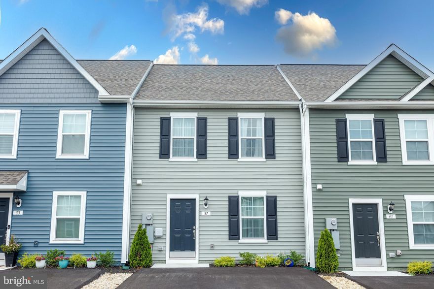 Back on the market through no fault of the seller! Move-in ready townhouse in highly sought-after Whispering Pines! This impeccable home was completed in December 2023 and has been lovingly and gently treated. A recent home inspection report shows the home is in excellent condition. Don't wait for a new build! This better-than-new home is available immediately, and won't last long. A new washer and dryer convey with the property. A new water softener has been added. The kitchen features an elegant tile backsplash and multi-purpose built-in microwave/air fryer/oven/convection oven.