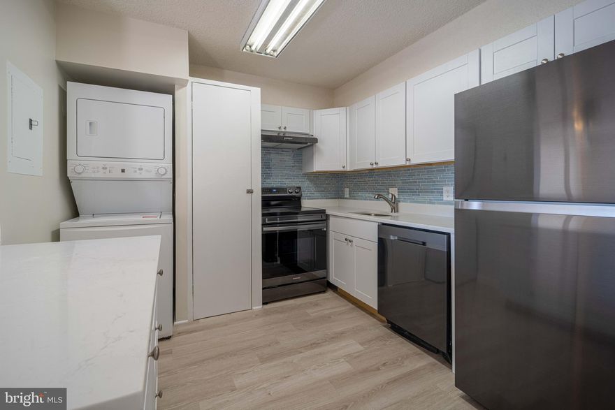 Discover this Hidden Gem near Lake Barcroft in Bailey’s Crossroads! This beautifully updated condo features a recently renovated kitchen with sleek granite countertops, modern white cabinetry, and stylish black stainless steel appliances. Freshly painted with newer luxury vinyl plank (LVP) flooring throughout, this home offers a spacious bedroom with a walk-in closet and a private balcony overlooking serene trees, a creek, and a scenic walking path.

Enjoy resort-style amenities, including indoor and outdoor pools, a hot tub, a steam room, a sauna, and 24-hour concierge service. Stay active with fully equipped cardio and free-weight gyms. Additional perks include extra storage, an assigned parking spot, and ample visitor parking. Conveniently located near shopping, dining, and public transportation, with easy access to Washington, D.C.

Don’t miss out on this incredible opportunity—schedule your tour today!