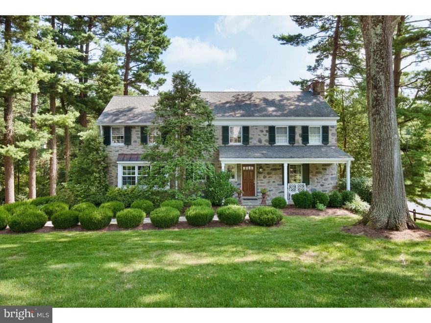 Situated in a quiet, conveniently located neighborhood and surrounded by beautifully landscaped, sprawling flat lawns and lush plantings, find this 5 Bedroom 4 Full and 1 Half bath stone Colonial home. A sense of welcome greets any visitor to this home, with evergreen shrubbery lining either side of a slate pathway leading to a stone porch. Enter through Foyer and to the right sits the Living Room with fireplace. Built-in Shelving and cabinetry flank either side of a set of French doors, which lead into a bright sunroom with skylight and door leading to side deck. To the left of the Foyer sits Dining Room, brightened by three oversized windows. The home's kitchen offers generous countertop prep space, seated center island with sink, and high-quality appliances such as a built-in subzero refrigerator with freezer drawers, 6 Burner Viking Range with double oven, and Whirlpool dishwasher. Across from the kitchen sits a breakfast area with additional cabinetry and closet storage and a butler's pantry with sink and wine refrigeration, while a family room with coffered ceiling and stone surround fireplace sits adjacent. Ascend the stair to the second-floor hall and find four family bedrooms, two sharing an adjoined bath while two others share a hall bath, as well as a laundry room. Towards the rear of the second floor sits the Master bedroom suite with his walk-in closet, her Walk-in closet with dressing area, and Master Bath with His and her sinks, soaking tub, and standing shower. Find additional family or entertaining space in the lower level, with stone and wood surround fireplace, full bathroom, and double doors leading out to a relaxing rear patio, offering stunning views of the home's yard.