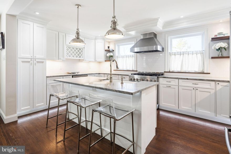 Welcome to 7529 Valley Ave, a beautifully updated 4-bedroom, 3.5-bath home in the highly sought‑after Roxborough section of Philadelphia. Offering exceptional space, modern finishes, and unbeatable convenience, this property delivers the perfect blend of comfort and style.

Step inside to discover an open‑concept main level featuring rich hardwood floors, recessed lighting, and abundant natural light. The spacious living room flows seamlessly to the dining area and into a chef-inspired kitchen complete with quartz countertops, extensive cabinetry, bar seating, stainless steel appliances, a farmhouse sink, and a built‑in wine cooler—ideal for both everyday living and entertaining.

Just off the living area, enjoy direct access to the upper deck, perfect for grilling or relaxing, with stairs leading to the expansive fenced‑in backyard. A stylish half bath completes this level.

Upstairs, the primary suite offers exceptional comfort with a custom built‑in closet and a private en‑suite bath featuring a sleek marble shower. Three additional generously sized bedrooms and a well-appointed full hall bath provide plenty of space for family, guests, or a home office.

The fully finished basement adds tremendous versatility—perfect for a home theater, gym, playroom, or guest suite. This level includes a full bathroom, a dedicated laundry area with cabinetry and counter space, and direct access to both the covered lower patio and the attached garage.

Outside, the large fenced yard offers endless possibilities for gardening, outdoor activities, or creating your own private retreat.

Located just minutes from the scenic trails of Wissahickon Valley Park and the vibrant shops and dining of Manayunk, this home offers the ideal balance of nature and city living. With easy access to Center City and major roadways, Roxborough remains a top choice for buyers seeking convenience, community, and charm.

Don’t miss your chance to make this exceptional property your next home. Schedule your showing today!